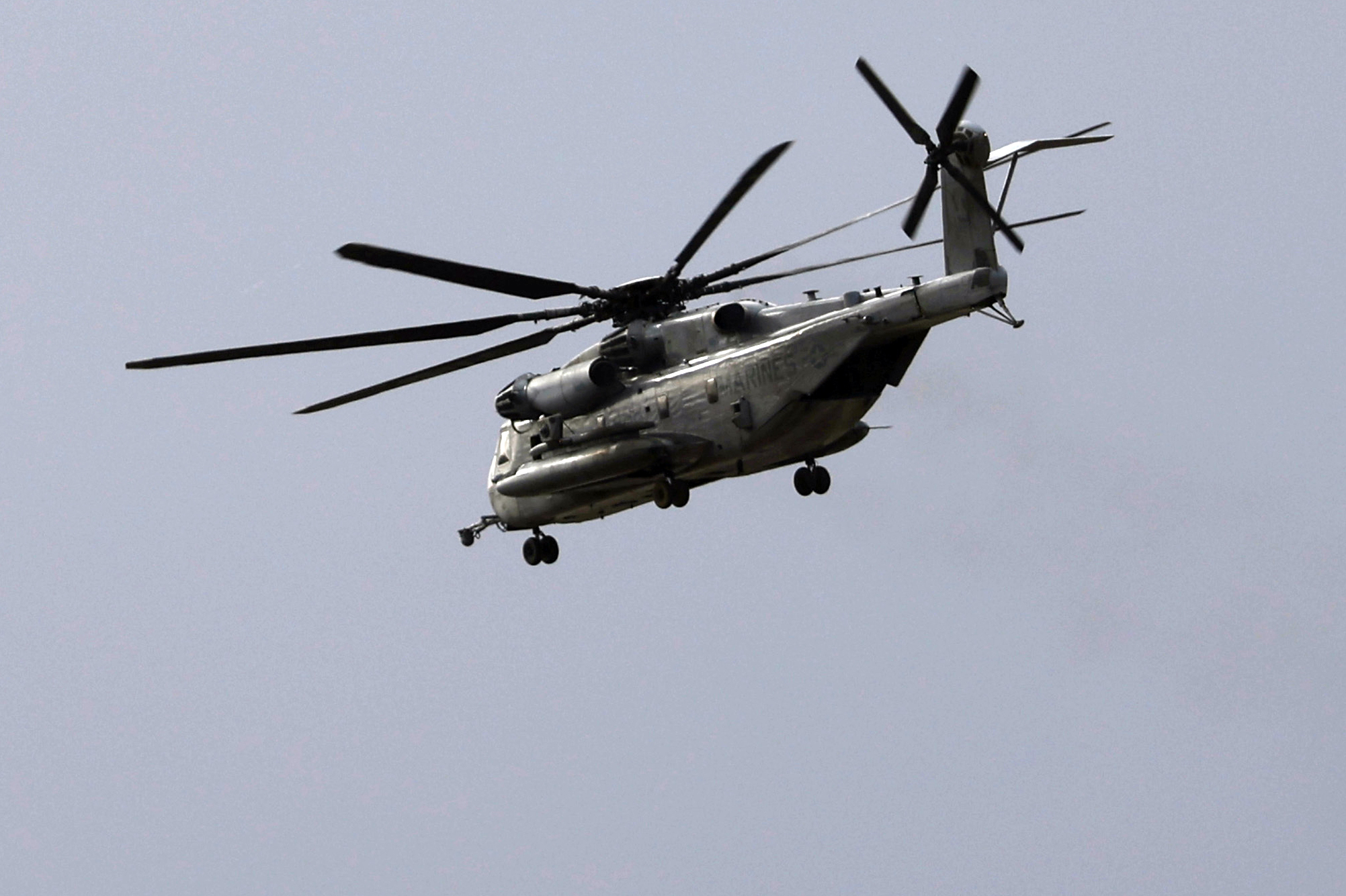 FILE - A Marine CH-53E Super Stallion helicopter flies during training at Marine Corps Air Station Miramar in San Diego, Feb. 6, 2024. A Marine Corps helicopter, like the one pictured, that crashed of last year and that killed five service members, was ultimately caused by pilot error, but the use of night vision goggles and unsafe flying conditions also likely were factors. That's according to a crash investigation report obtained by The Associated Press. (K.C. Alfred/The San Diego Union-Tribune via AP, file)