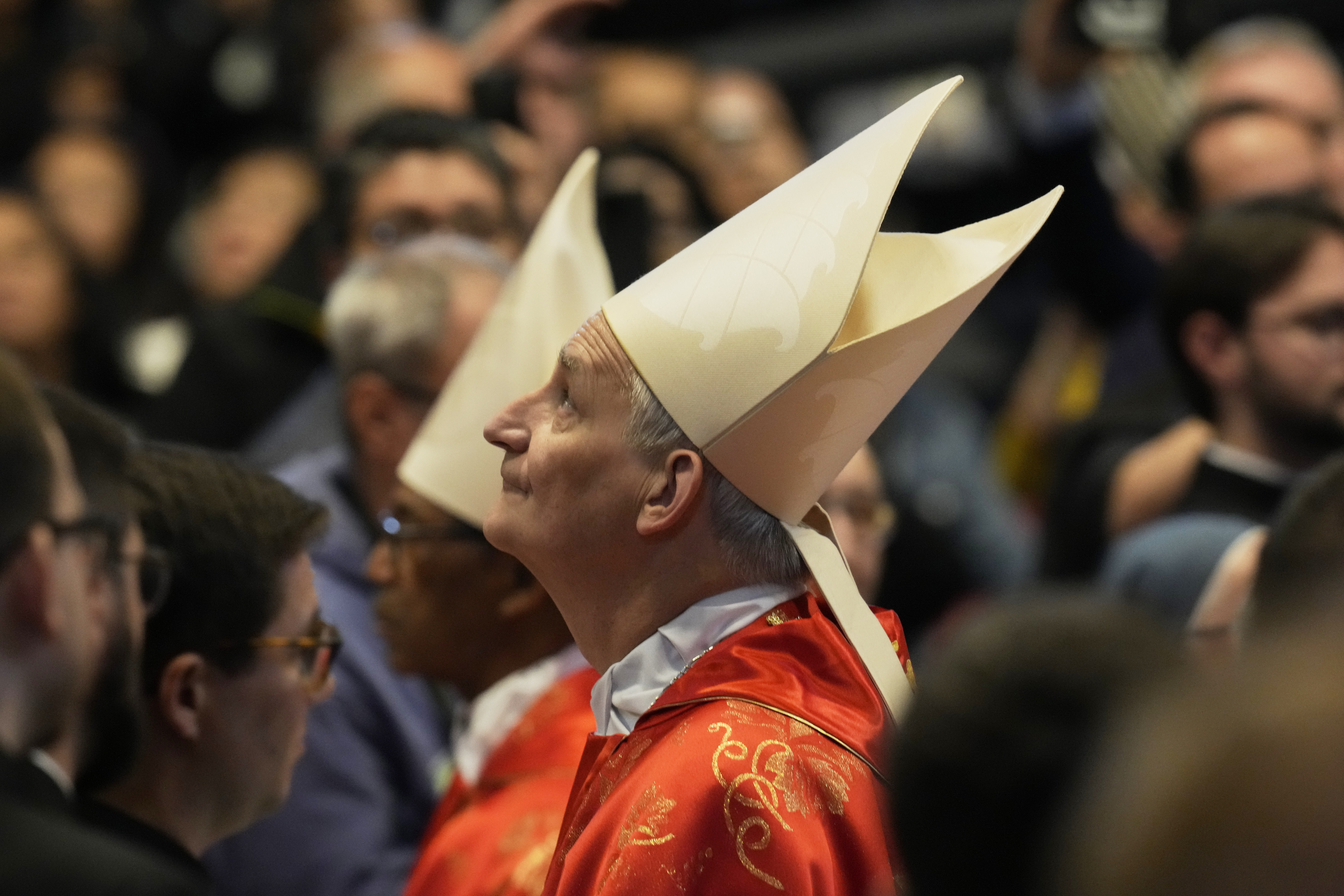 Cardinal Matteo Maria Zuppi looks up during a final Mass celebrated by cardinals inside St. Peter's Basilica, before the conclave to elect a new pope, at the Vatican, Wednesday, May 7, 2025. (AP Photo/Gregorio Borgia)