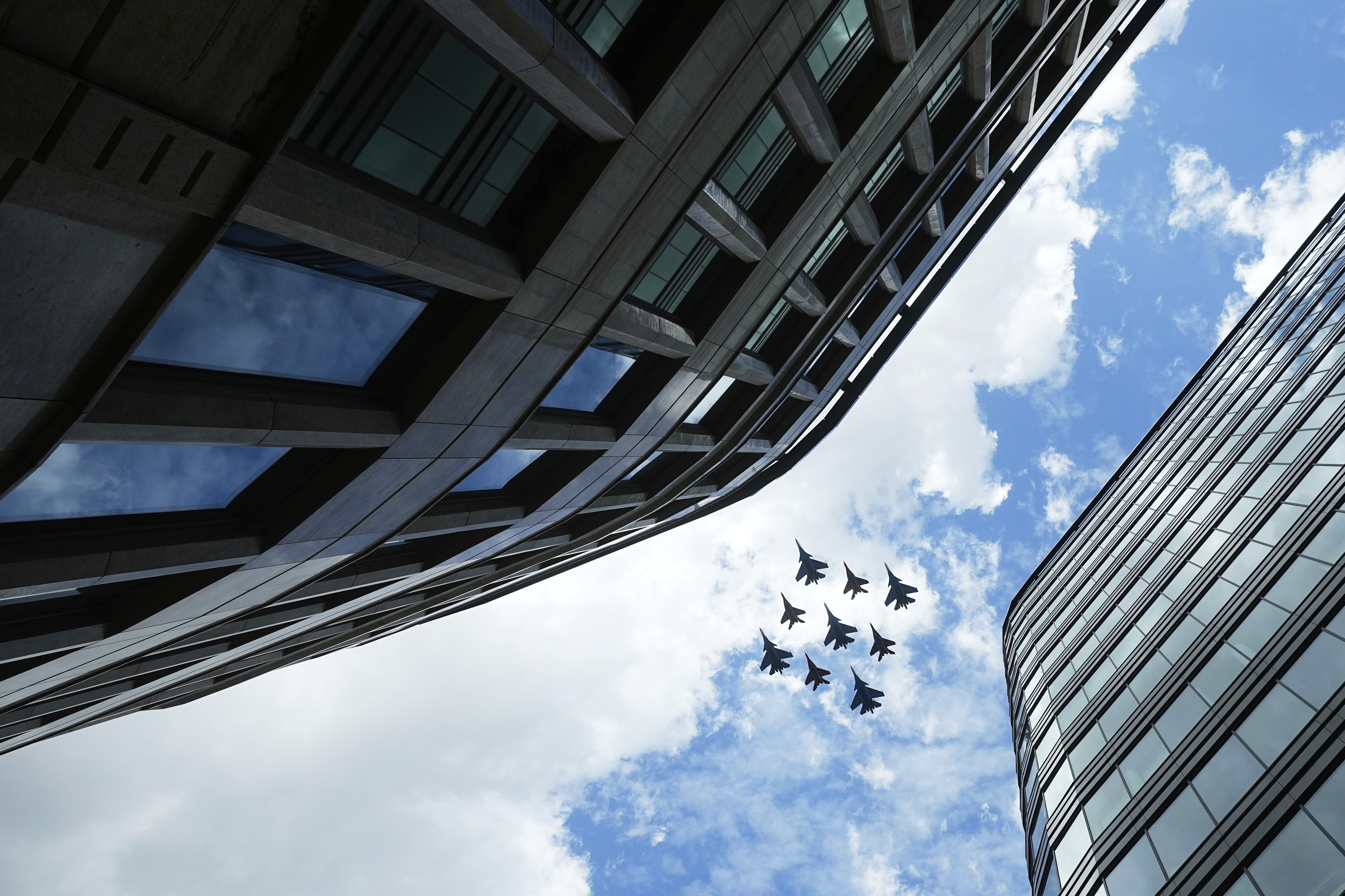 Russian Sukhoi Su-30SM jet fighters of The Russian Knights aerobatic team and Mikoyan MiG-29 jet fighters of The Swifts aerobatic team fly towards the Red Square for the Victory Day military parade general rehearsal in Moscow, Russia, Wednesday, May 7, 2025. (AP Photo/Pavel Bednyakov)