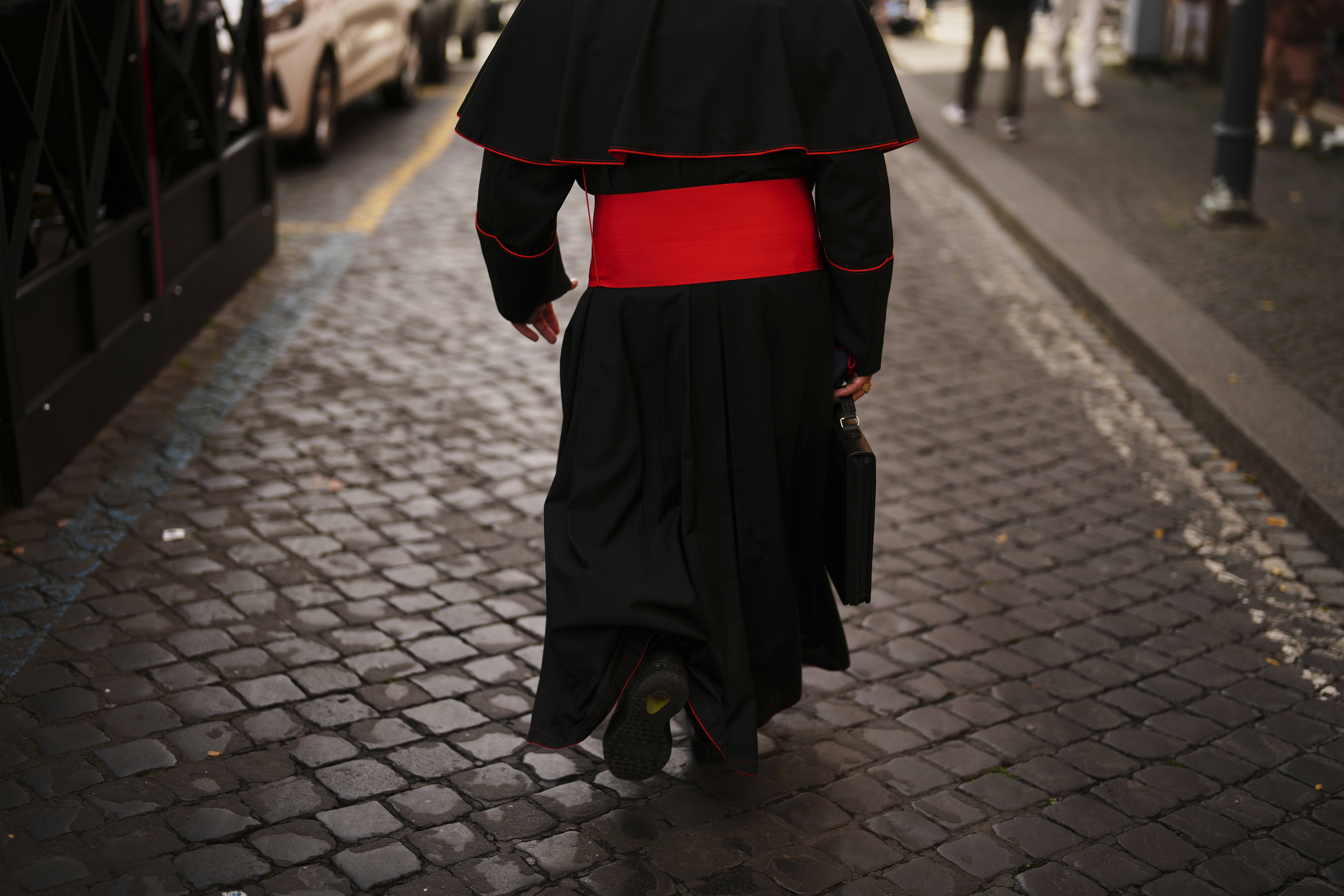 Cardinal John Dew leaves the Vatican on Monday, May 5, 2025, after attending the General Congregation of cardinals in the New Synod Hall where they are preparing for the upcoming conclave starting on May 7, to elect the 267th Roman pontiff. (AP Photo/Francisco Seco)