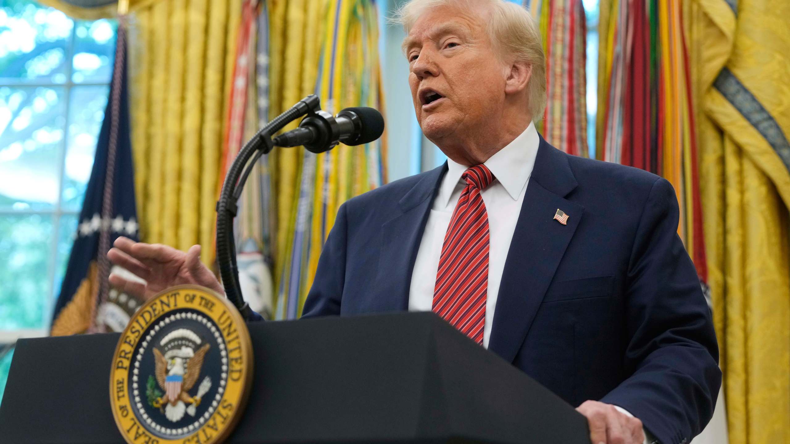 President Donald Trump speaks after David Perdue was sworn in as U.S. Ambassador to China during a ceremony in the Oval Office of the White House, Wednesday, May 7, 2025, in Washington. (AP Photo/Mark Schiefelbein)