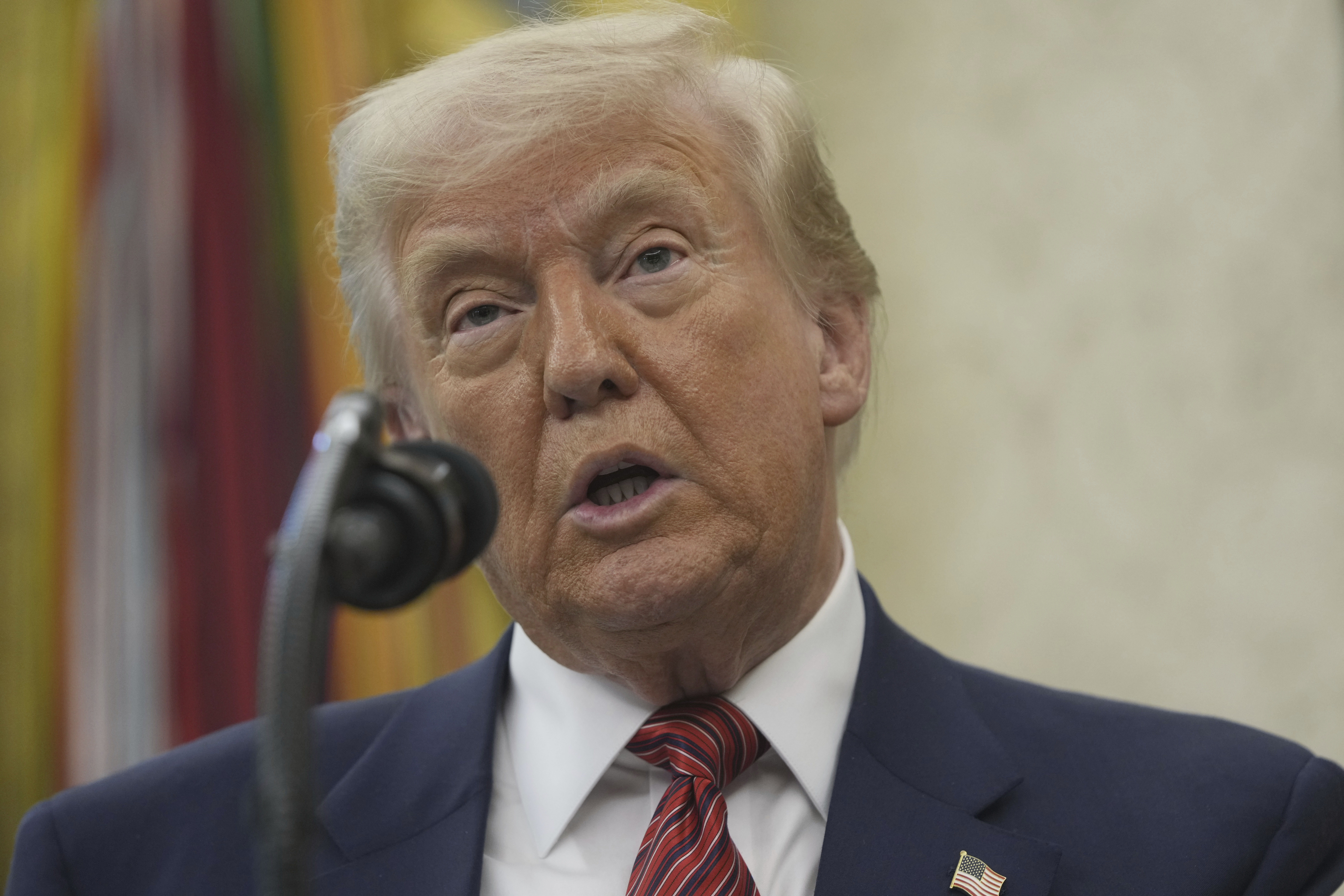 President Donald Trump speaks before David Perdue is sworn in as U.S. Ambassador to China during a ceremony in the Oval Office of the White House, Wednesday, May 7, 2025, in Washington. (AP Photo/Mark Schiefelbein)