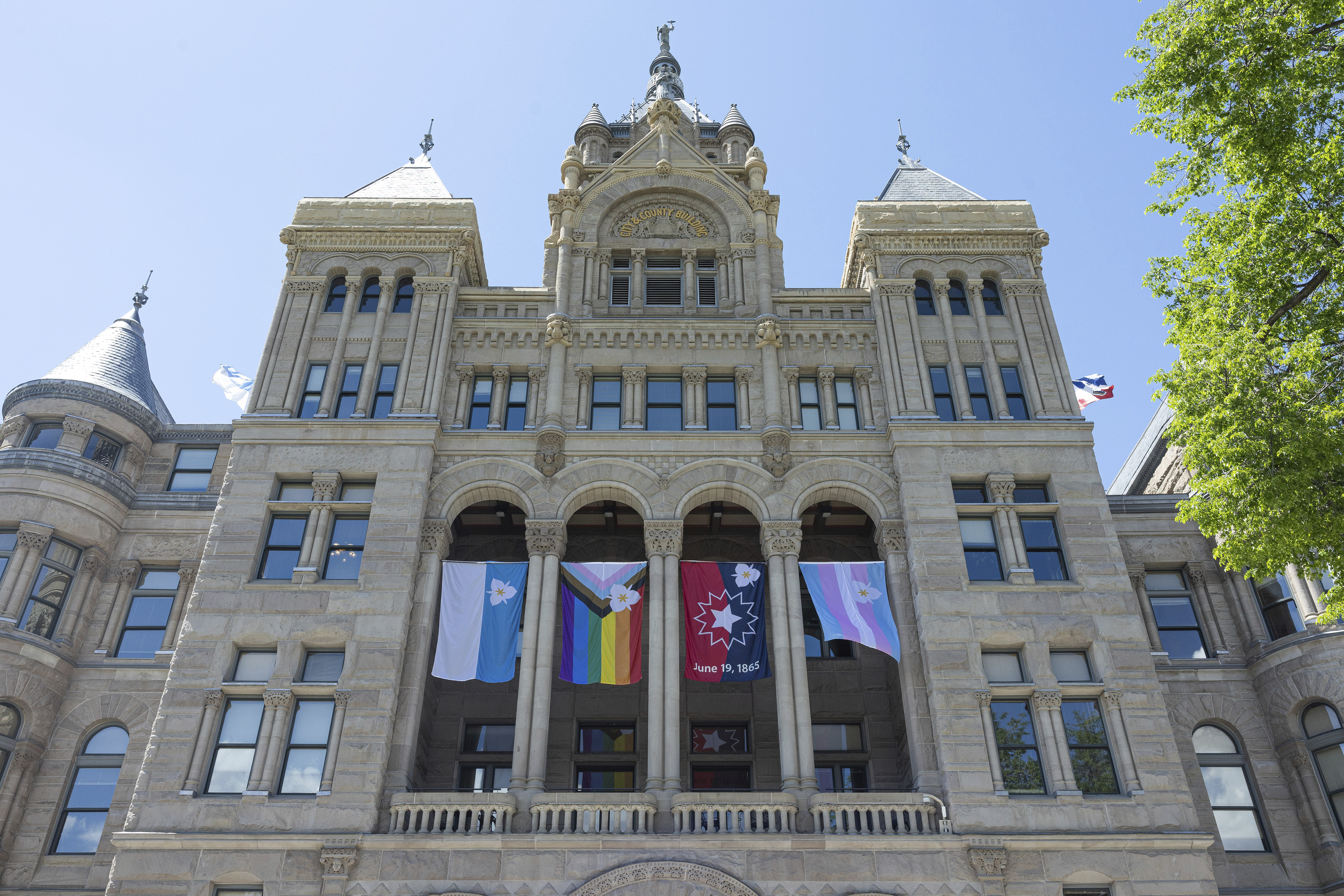 The newly adopted city flags are displayed at the Salt Lake City and County building showing support for LGBTQ+ in defiance of their state's Republican controlled Legislature, Wednesday, May 7, 2025, in Salt Lake City. (AP Photo/Melissa Majchrzak)