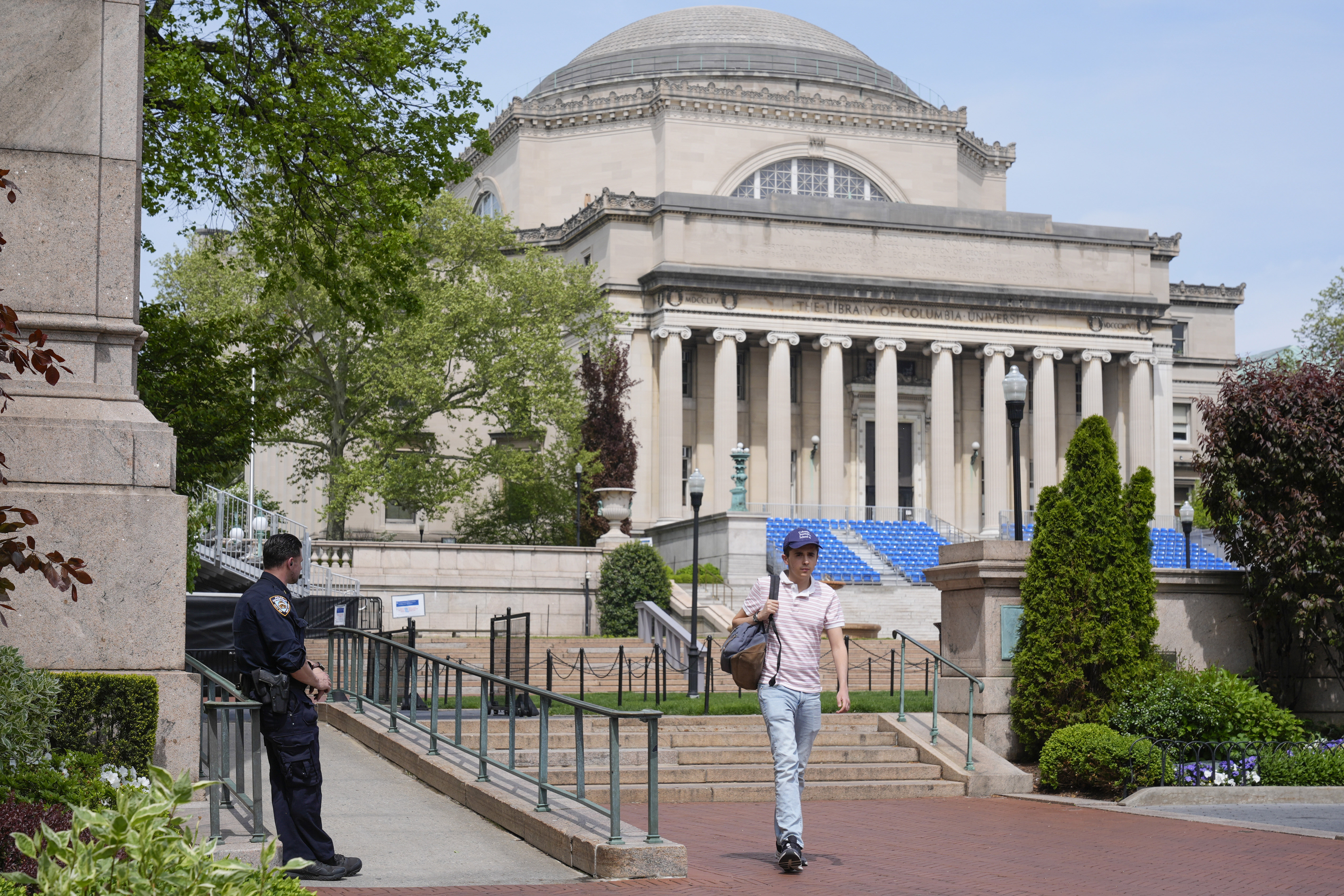 FILE - A New York City police officer keeps watch on the campus of Columbia University in New York, Monday, May 6, 2024. (AP Photo/Seth Wenig, File)