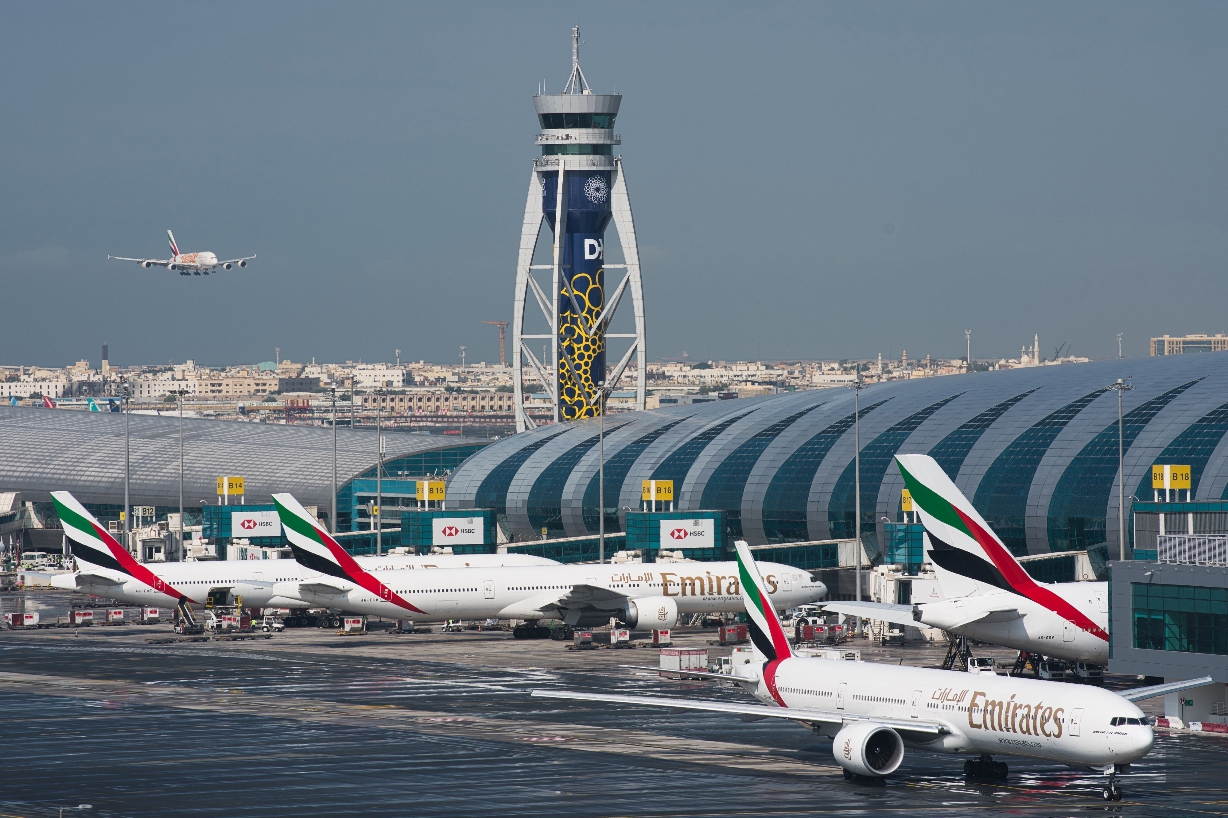 FILE - An Emirates jetliner comes in for landing at the Dubai International Airport in Dubai, United Arab Emirates, Dec. 11, 2019. (AP Photo/Jon Gambrell, File)
