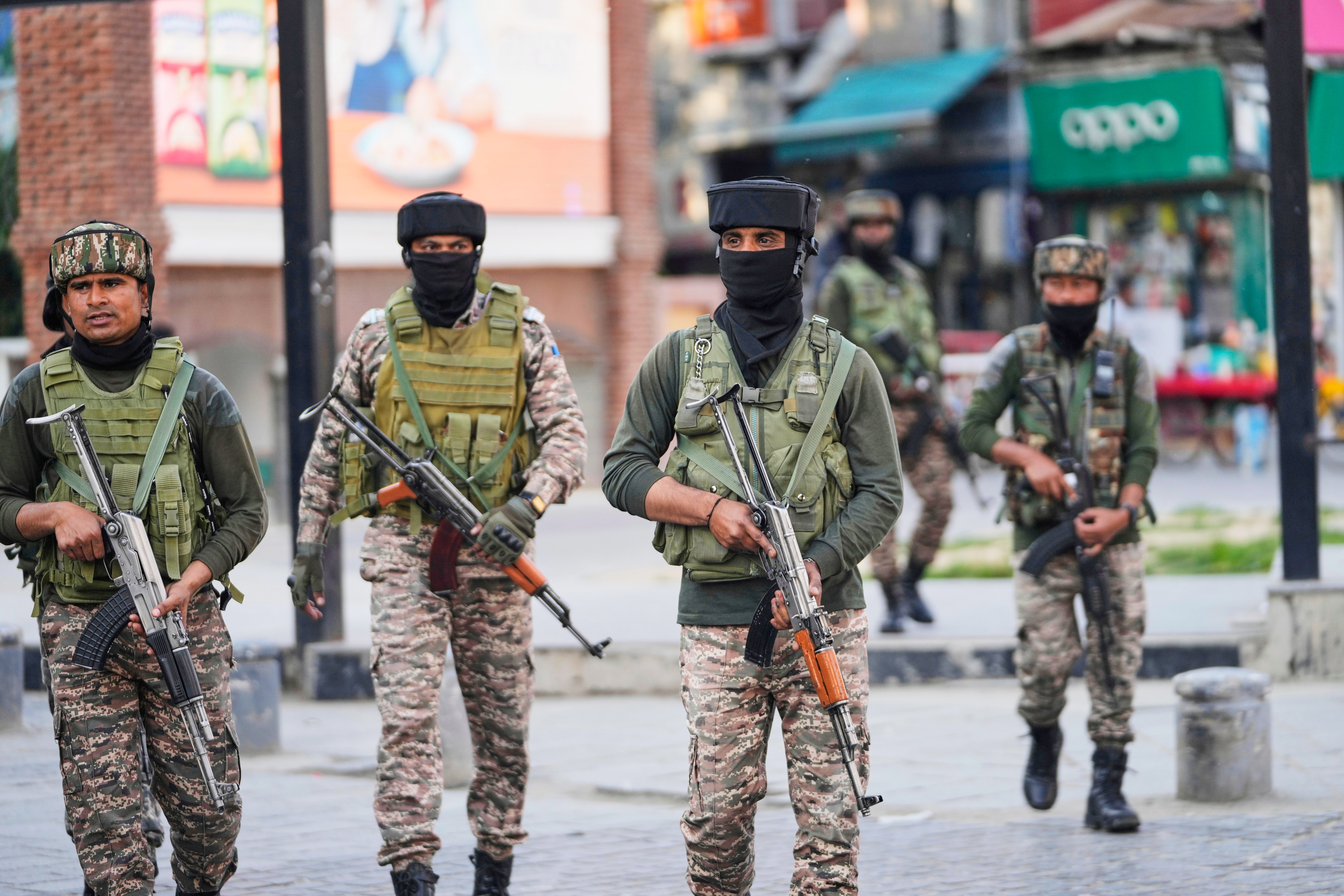 Indian soldiers guard at a market in Srinagar, Indian controlled Kashmir, Tuesday, May 6, 2025. (AP Photo/Mukhtar Khan)