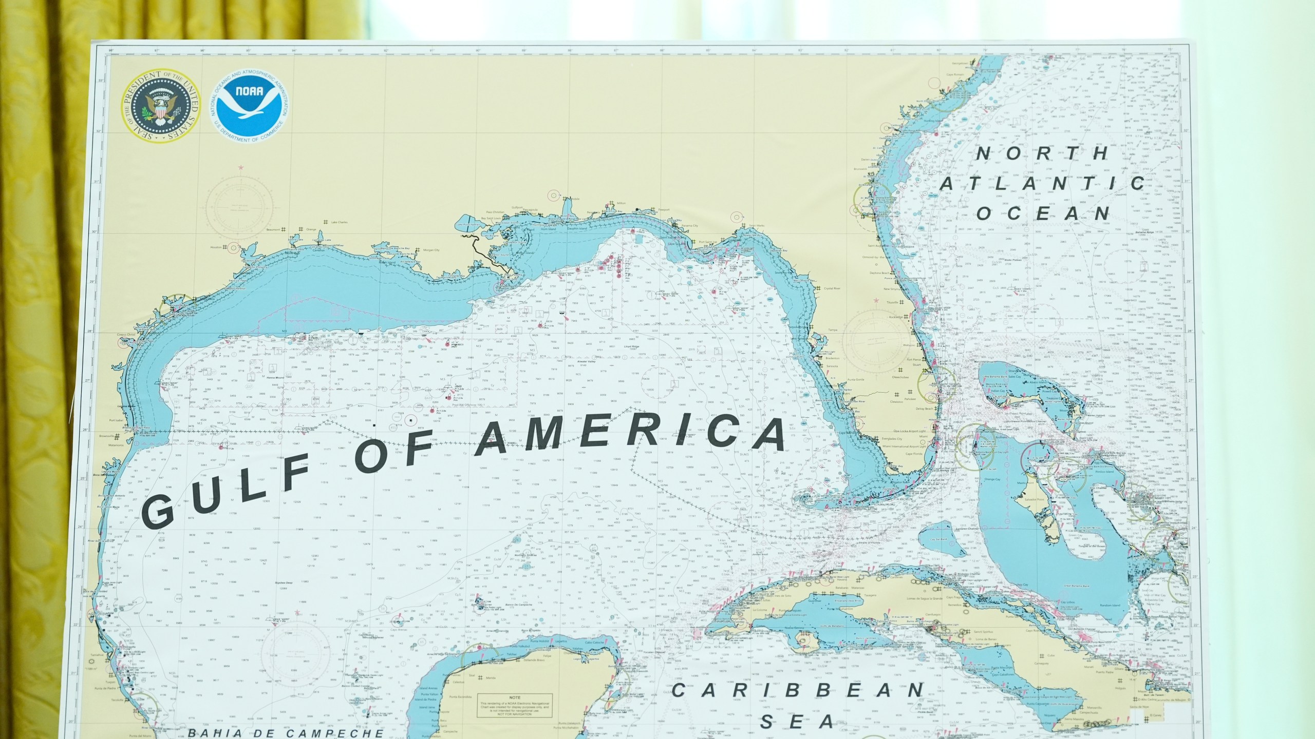 A map with Gulf of America written on it is pictured during a swearing in ceremony for Dr. Mehmet Oz to be Administrator of the Centers for Medicare and Medicaid Services, in the Oval Office of the White House, Friday, April 18, 2025, in Washington. (AP Photo/Alex Brandon)