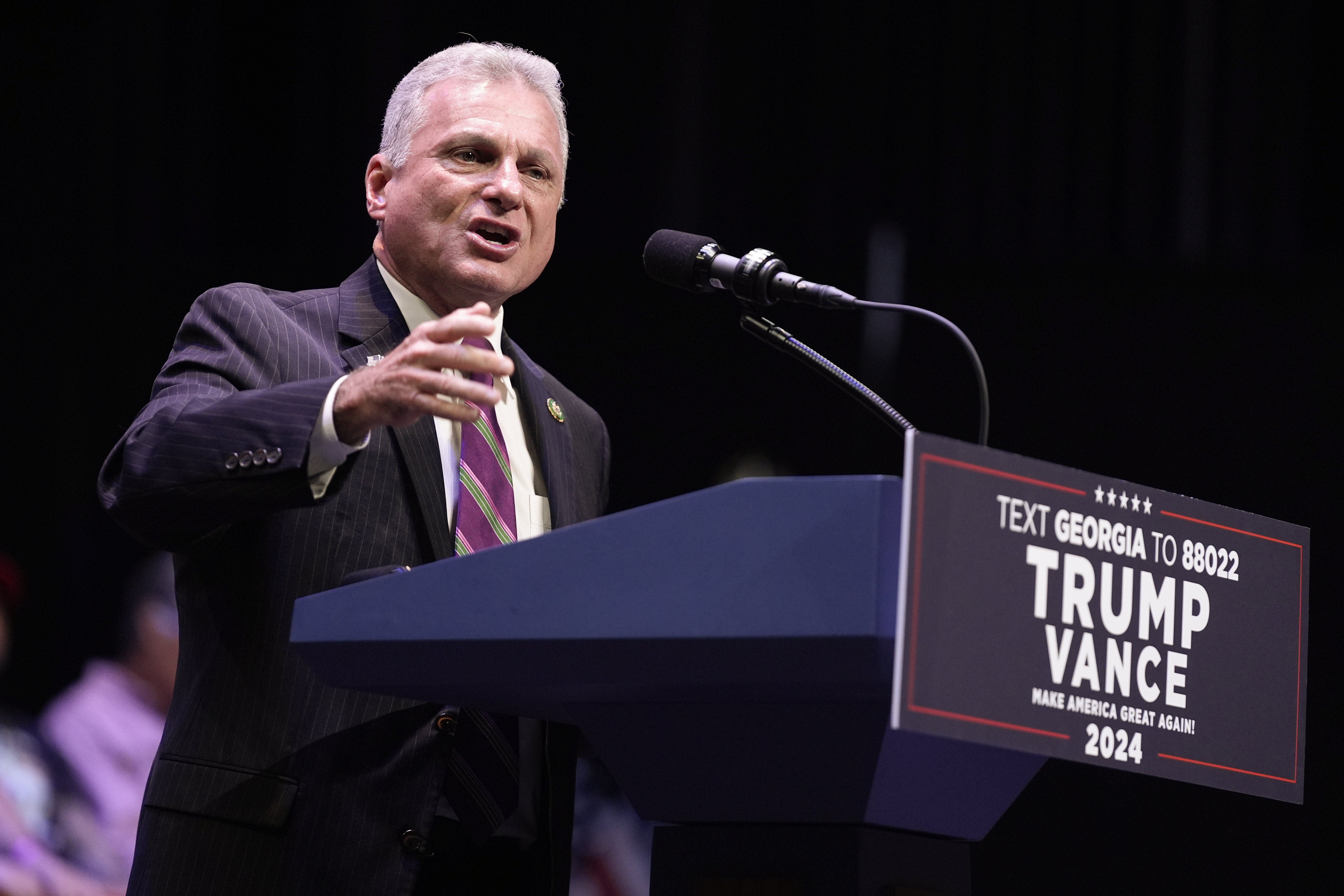 FILE - Rep. Buddy Carter, R-Ga., speaks before Republican presidential candidate former President Donald Trump arrives to deliver remarks on the tax code, and manufacturing at the Johnny Mercer Theatre Civic Center, Tuesday, Sept. 24, 2024, in Savannah, Ga. (AP Photo/Evan Vucci, File)