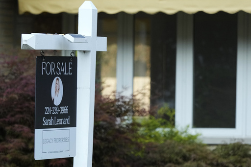 FILE - A "For Sale" sign is displayed in front of a home in Des Plaines, Ill., Monday, Aug. 26, 2024. (AP Photo/Nam Y. Huh, File)