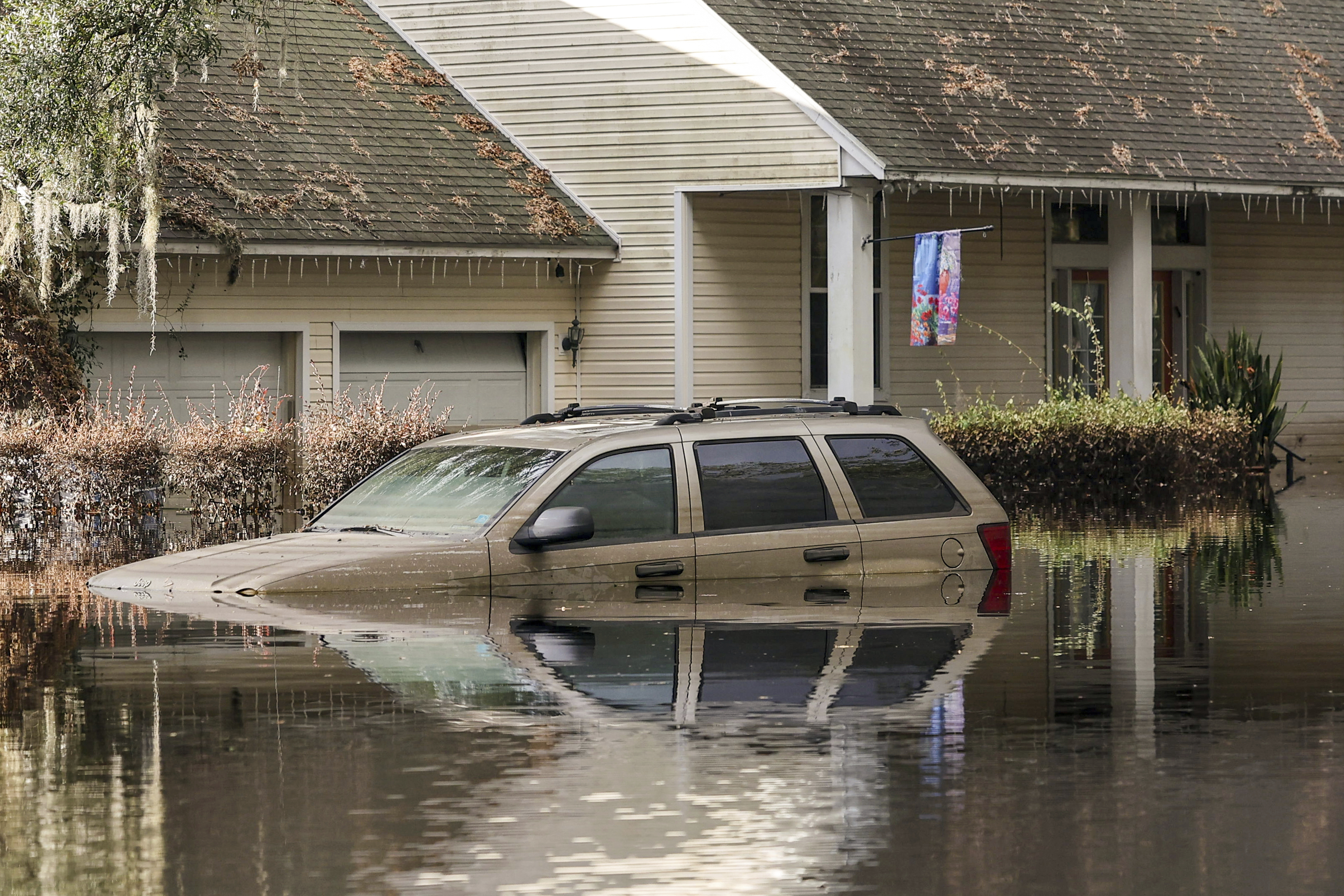 FILE - A neighborhood still flooded from Hurricane Milton prepares to have the FEMA Disaster Recover Center covert to a polling location for the general election on Monday, Nov. 4, 2024, in Ridge Manor, Fla. (AP Photo/Mike Carlson, File)