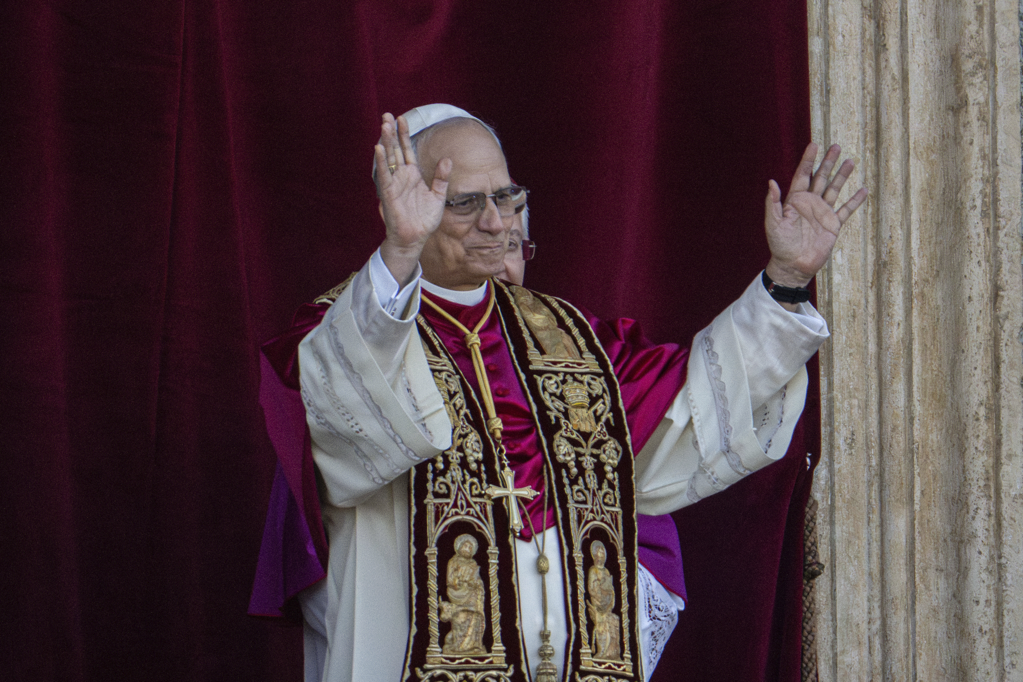 Newly elected Pope Leo XIV, formerly Cardinal Robert Francis Prevost, appears on the central loggia of St. Peter's Basilica at the Vatican shortly after his election as the 267th pontiff of the Roman Catholic Church, Thursday, May 8, 2025. (AP Photo/Domenico Stinellis)