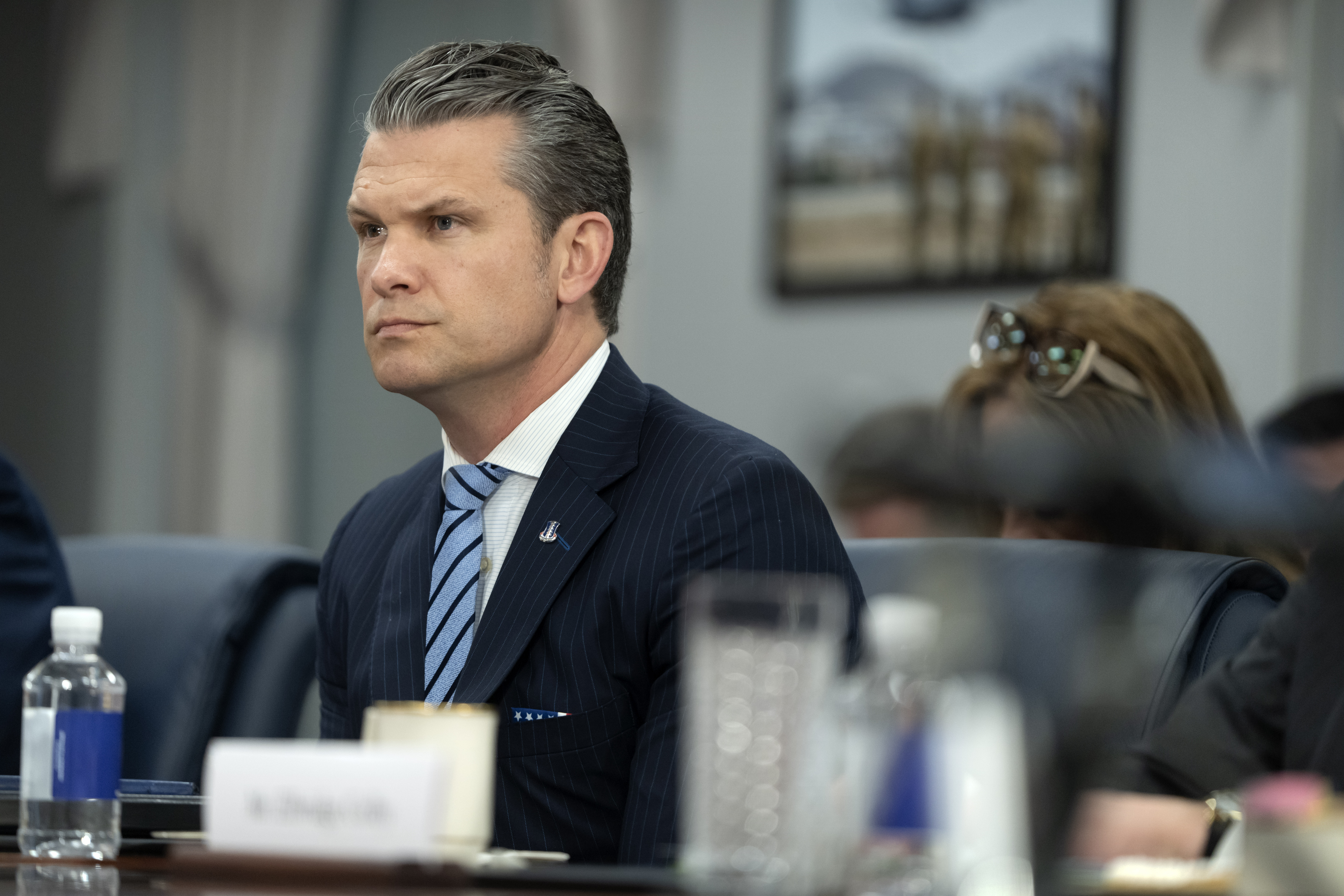 Secretary of Defense Pete Hegseth listens during a meeting with Peru's Foreign Affairs Minister Elmer Schialer and Peru's Minister of Defense Walter Astudillo at the Pentagon, Monday, May 5, 2025, in Washington. (AP Photo/Mark Schiefelbein)
