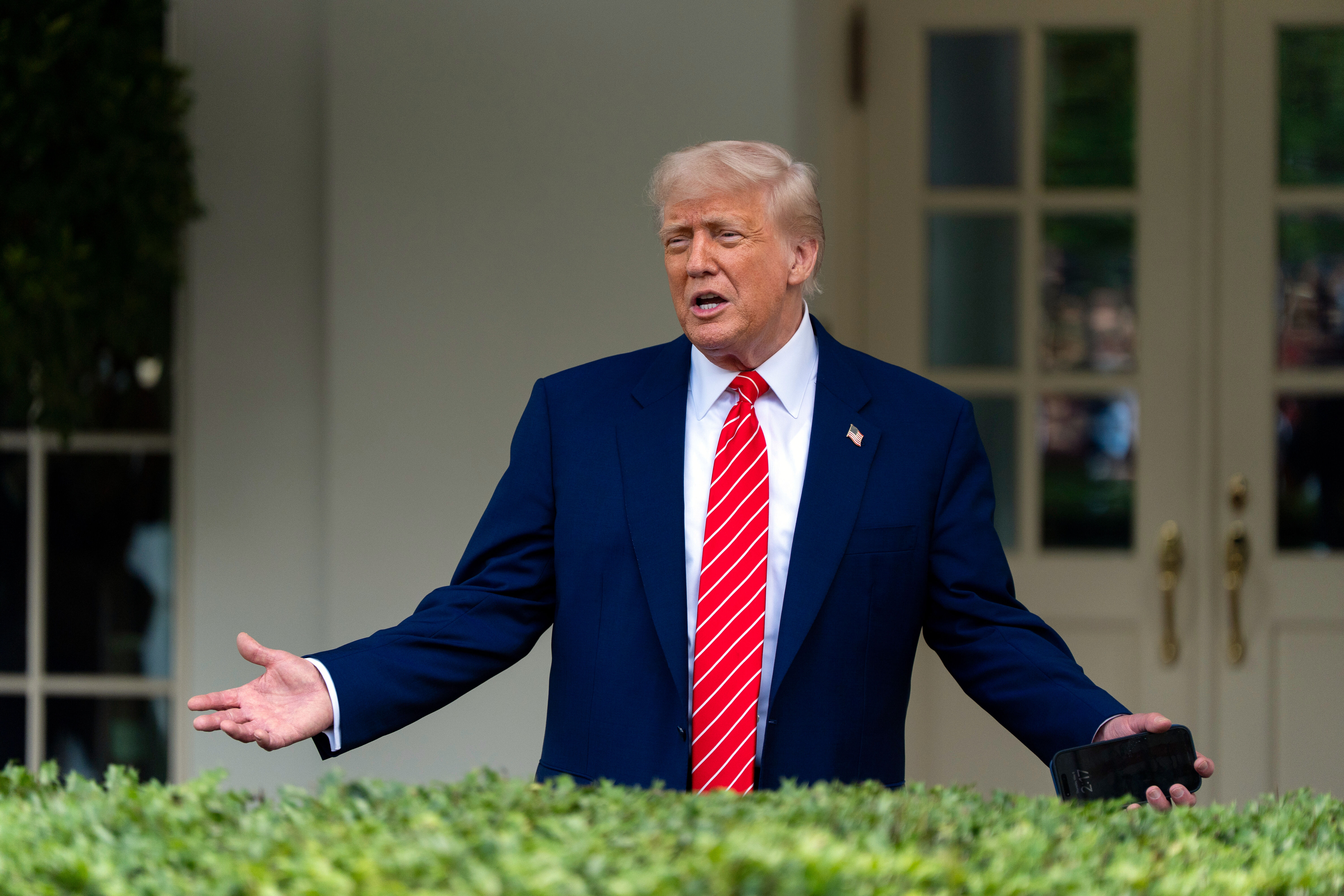 President Donald Trump speaks with reporters in front of the West Wing of the White House, Thursday, May 8, 2025, in Washington. (AP Photo/Alex Brandon)