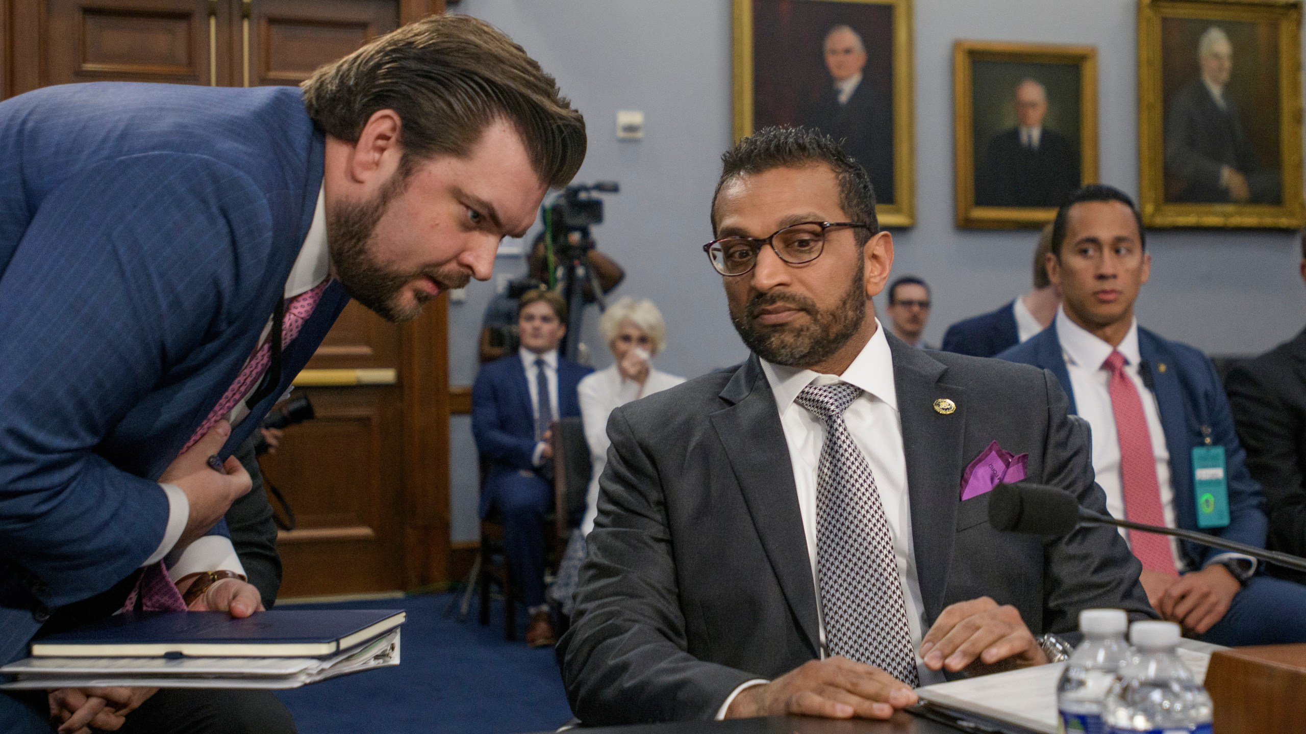 FBI director Kash Patel, right, confers with staff during a House Committee on Appropriations, Subcommittee on Commerce, Justice, Science, and Related Agencies budget hearing on the Fiscal Year 2026 Request for the Federal Bureau of Investigation, on Capitol Hill, Wednesday, May 7, 2025, in Washington. (AP Photo/Rod Lamkey, Jr.)