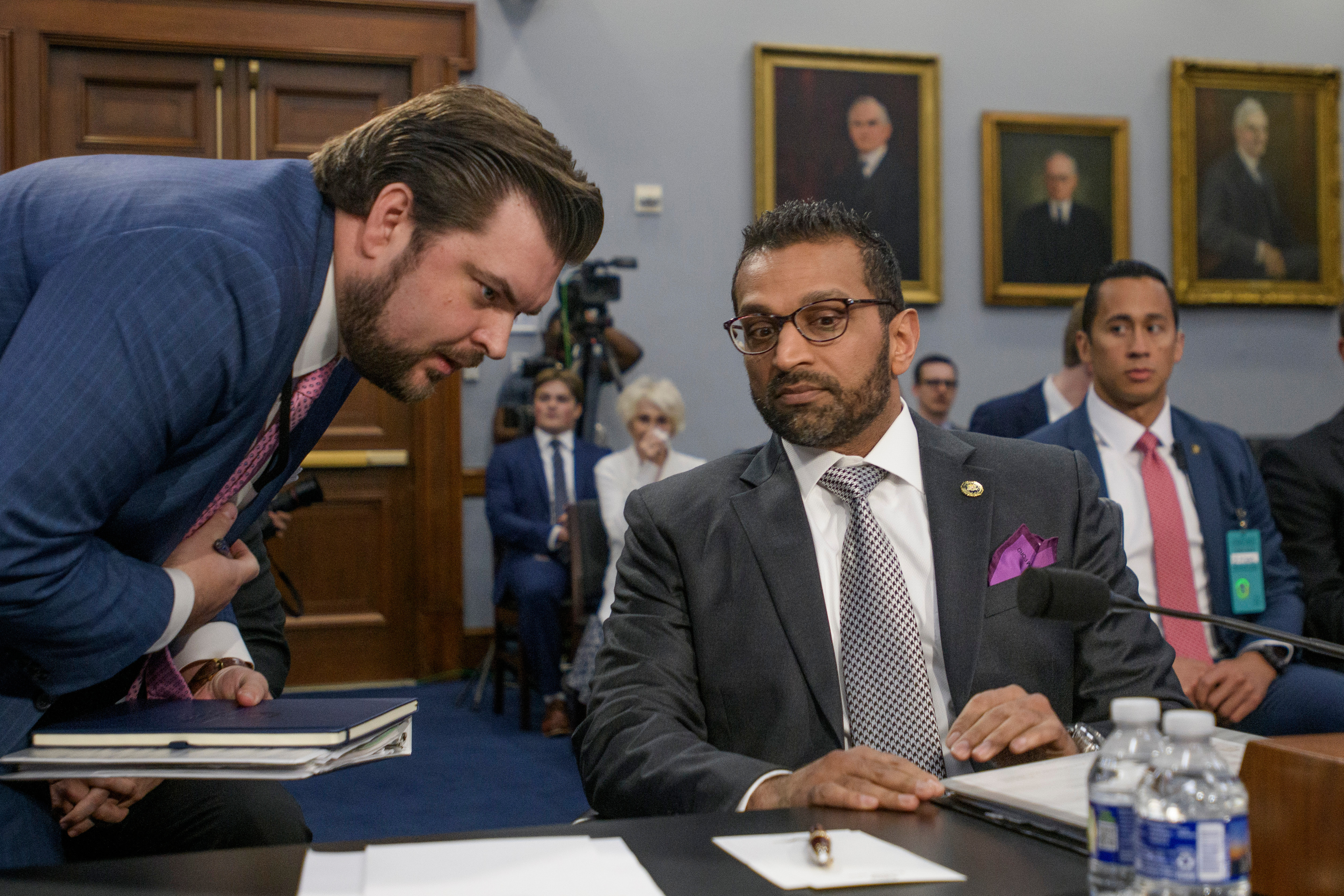 FBI director Kash Patel, right, confers with staff during a House Committee on Appropriations, Subcommittee on Commerce, Justice, Science, and Related Agencies budget hearing on the Fiscal Year 2026 Request for the Federal Bureau of Investigation, on Capitol Hill, Wednesday, May 7, 2025, in Washington. (AP Photo/Rod Lamkey, Jr.)