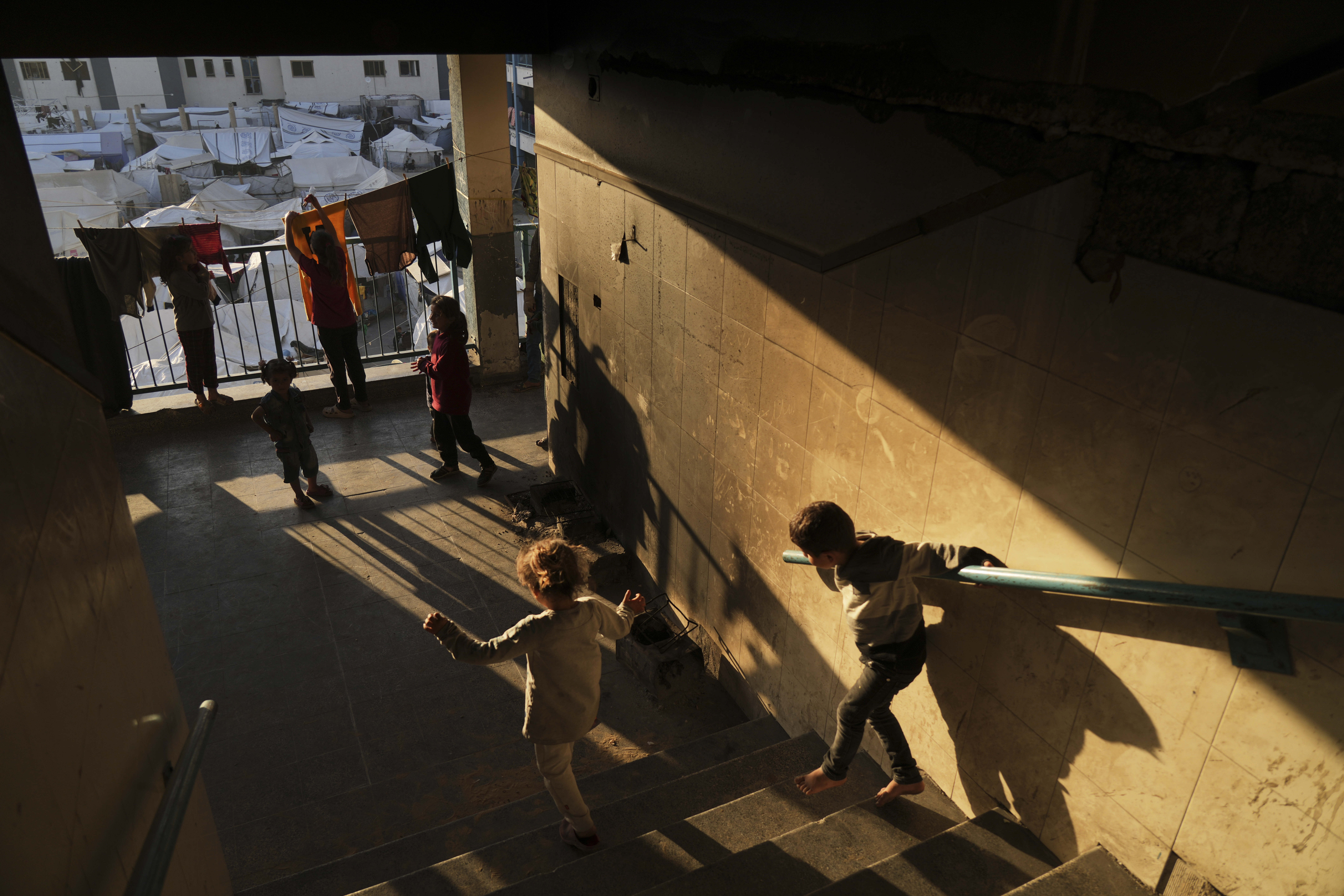 Displaced Palestinians live in a school that has been converted into a shelter in Gaza City amid the ongoing war in Gaza, Tuesday, May 6, 2025. (AP Photo/Jehad Alshrafi)