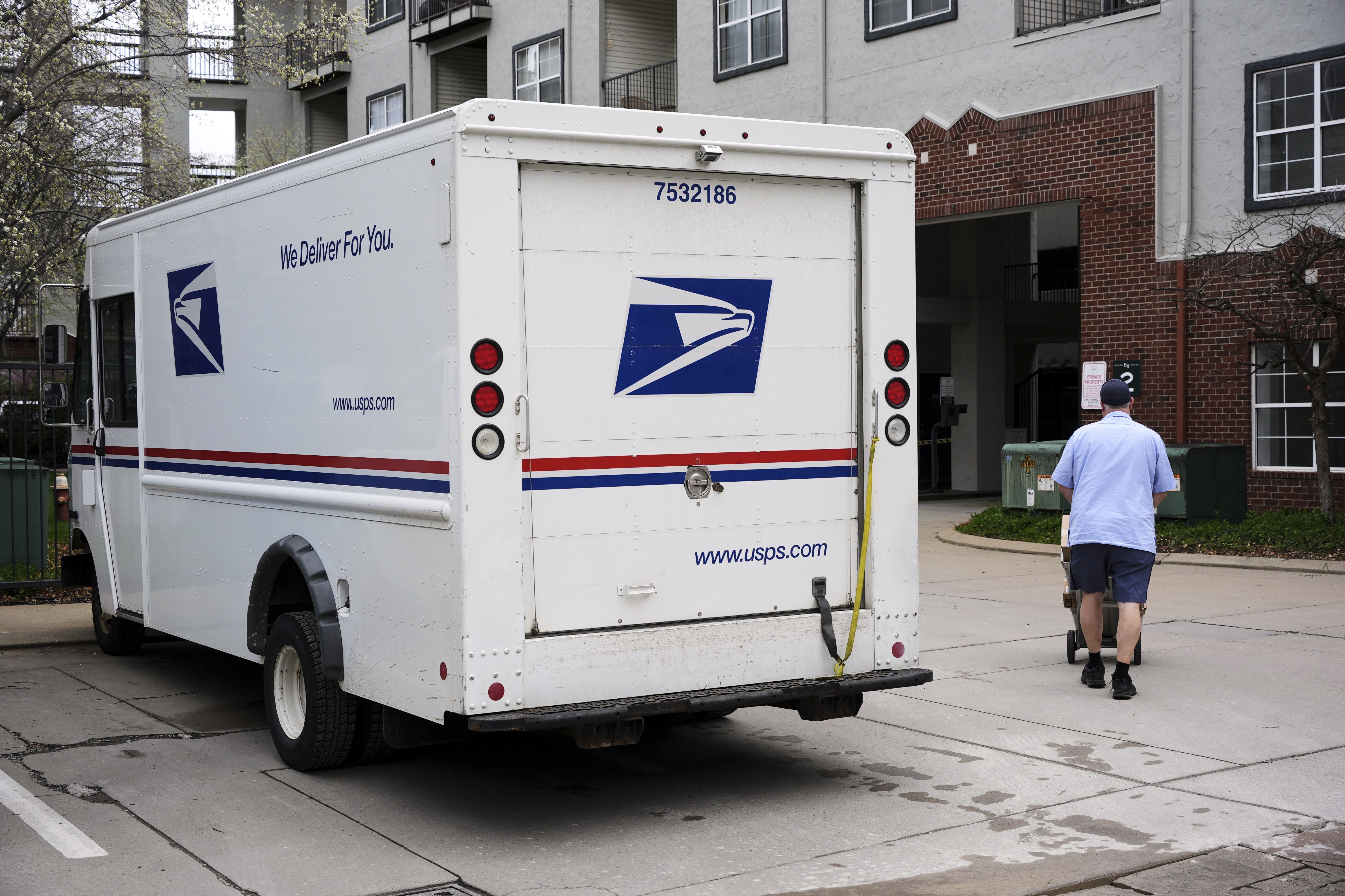 FILE - US Mail is delivered at to an apartment complex in Pittsburgh on Thursday, April 3, 2025. (AP Photo/Gene J. Puskar, File)