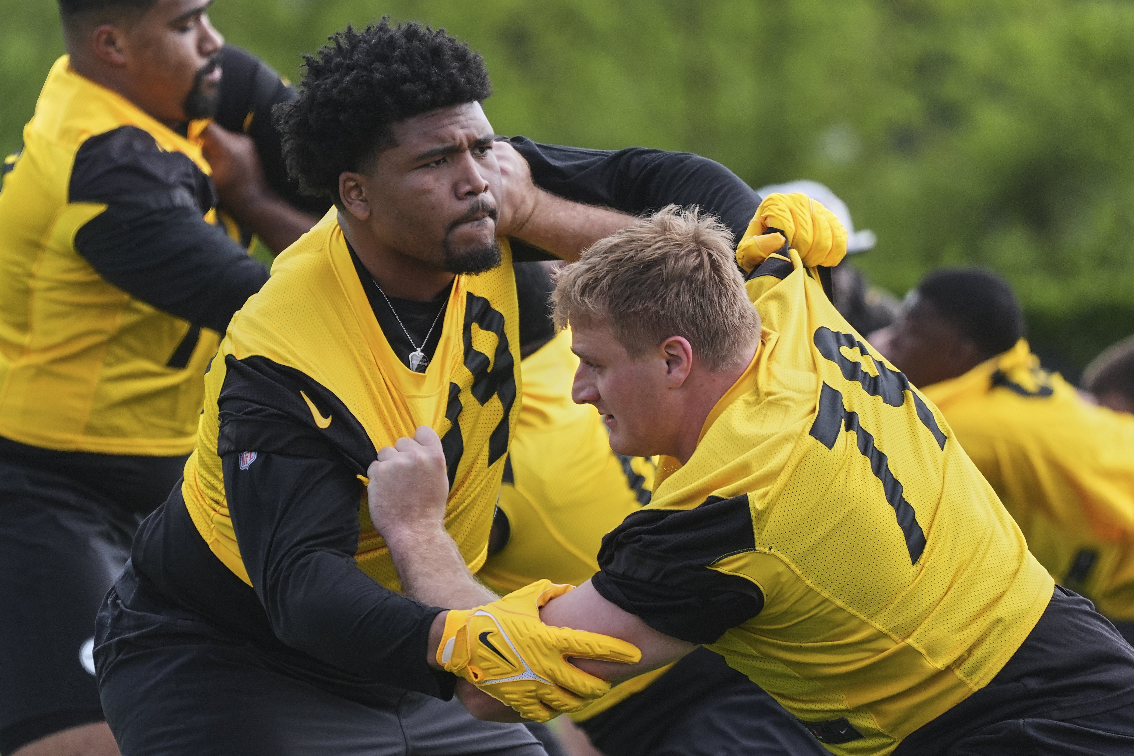 Pittsburgh Steelers first round draft pick Derrick Harmon, left, works against veteran Jacob Slade (79) during the NFL football team's rookie camp in Pittsburgh, Friday, May 9, 2025. (AP Photo/Gene J. Puskar)