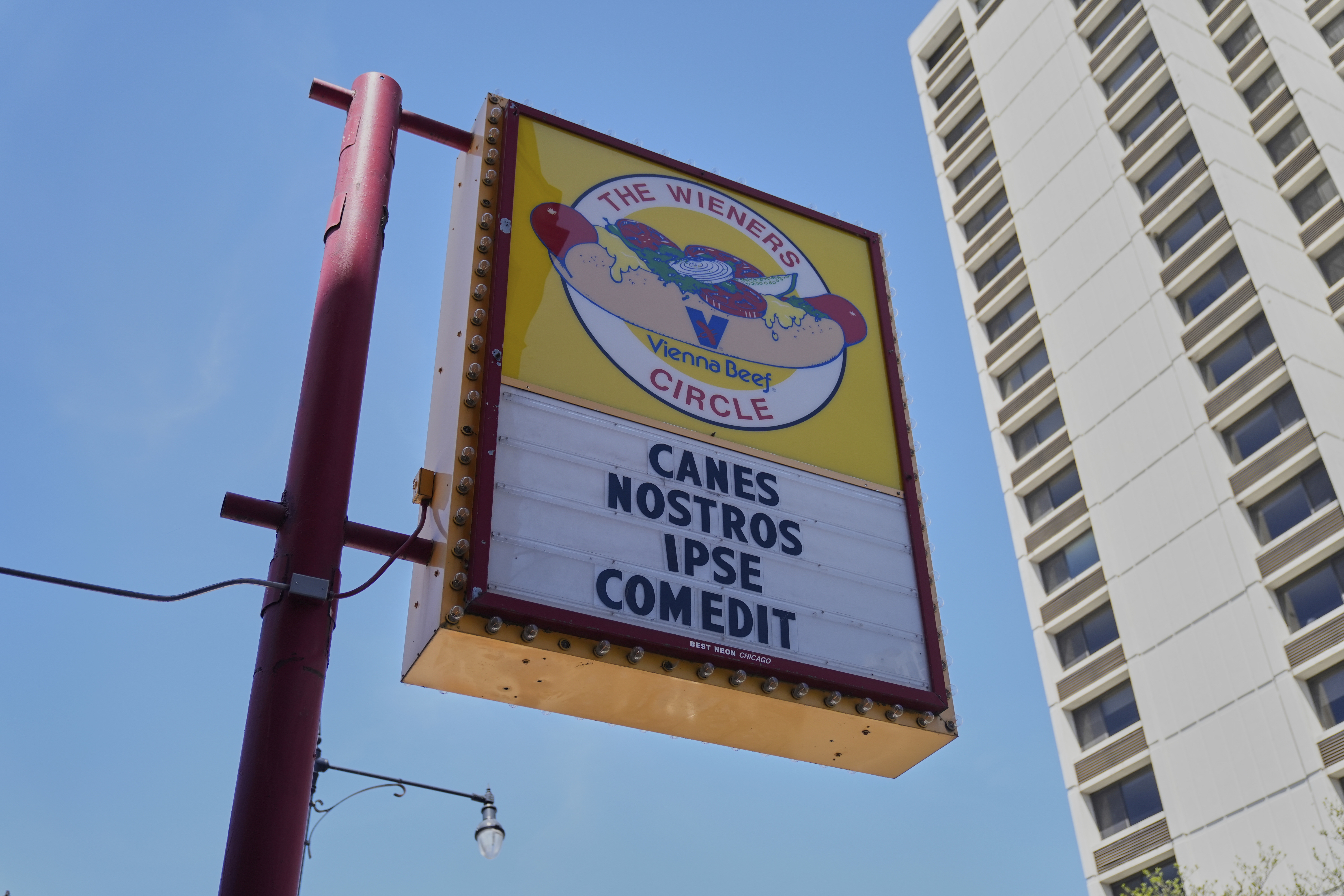 The Wiener's Circle, an iconic hot dog stand known for posting quirky phrases on its sign, posted on Instagram that its current sign translates to "He has eaten our dogs," Friday, May 9, 2025, in Chicago. (AP Photo/Erin Hooley)