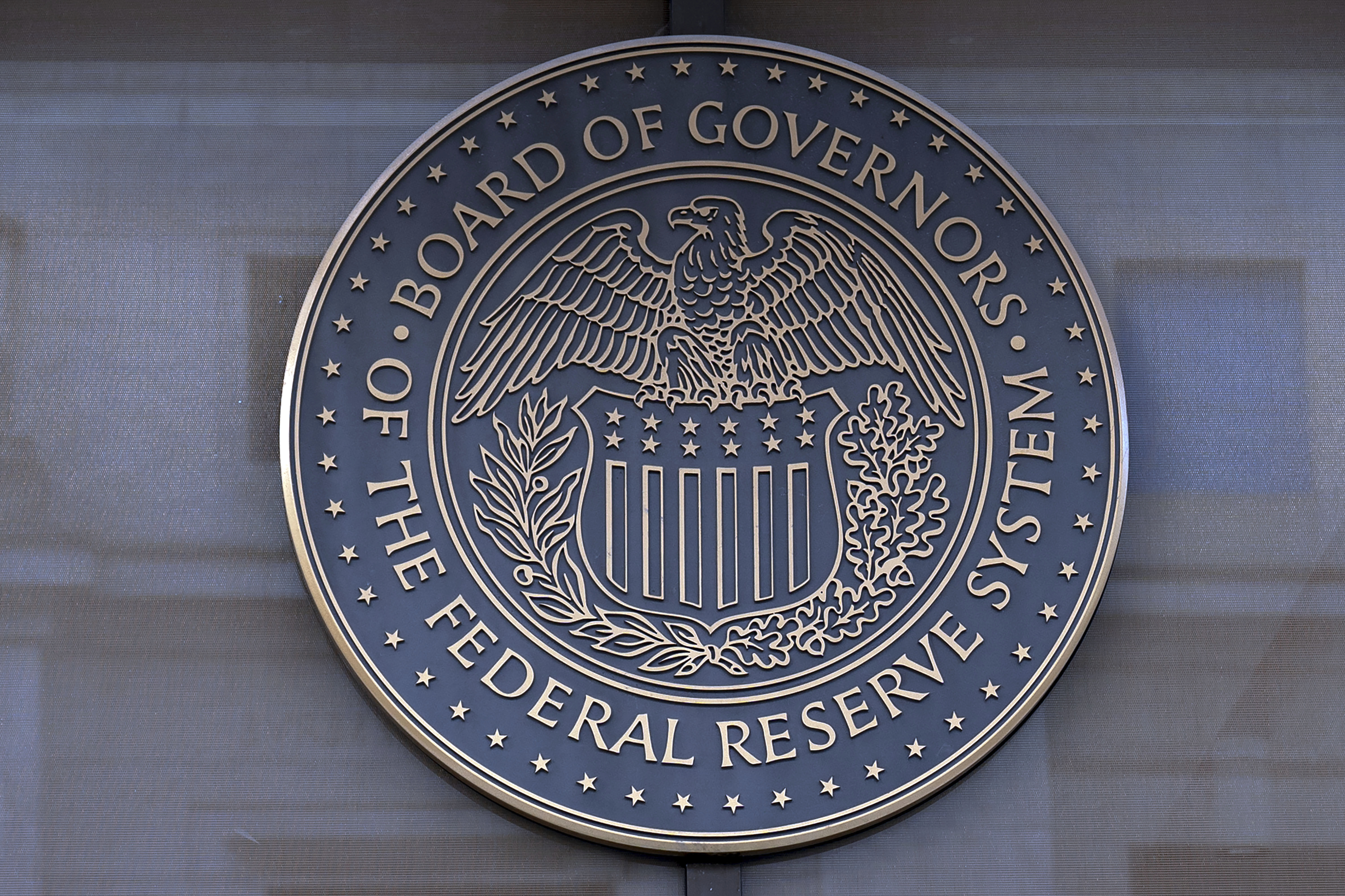 FILE - The seal of the Federal Reserve Board is seen at the Building in Washington, Saturday, Dec. 8, 2024. (AP Photo/Jose Luis Magana)