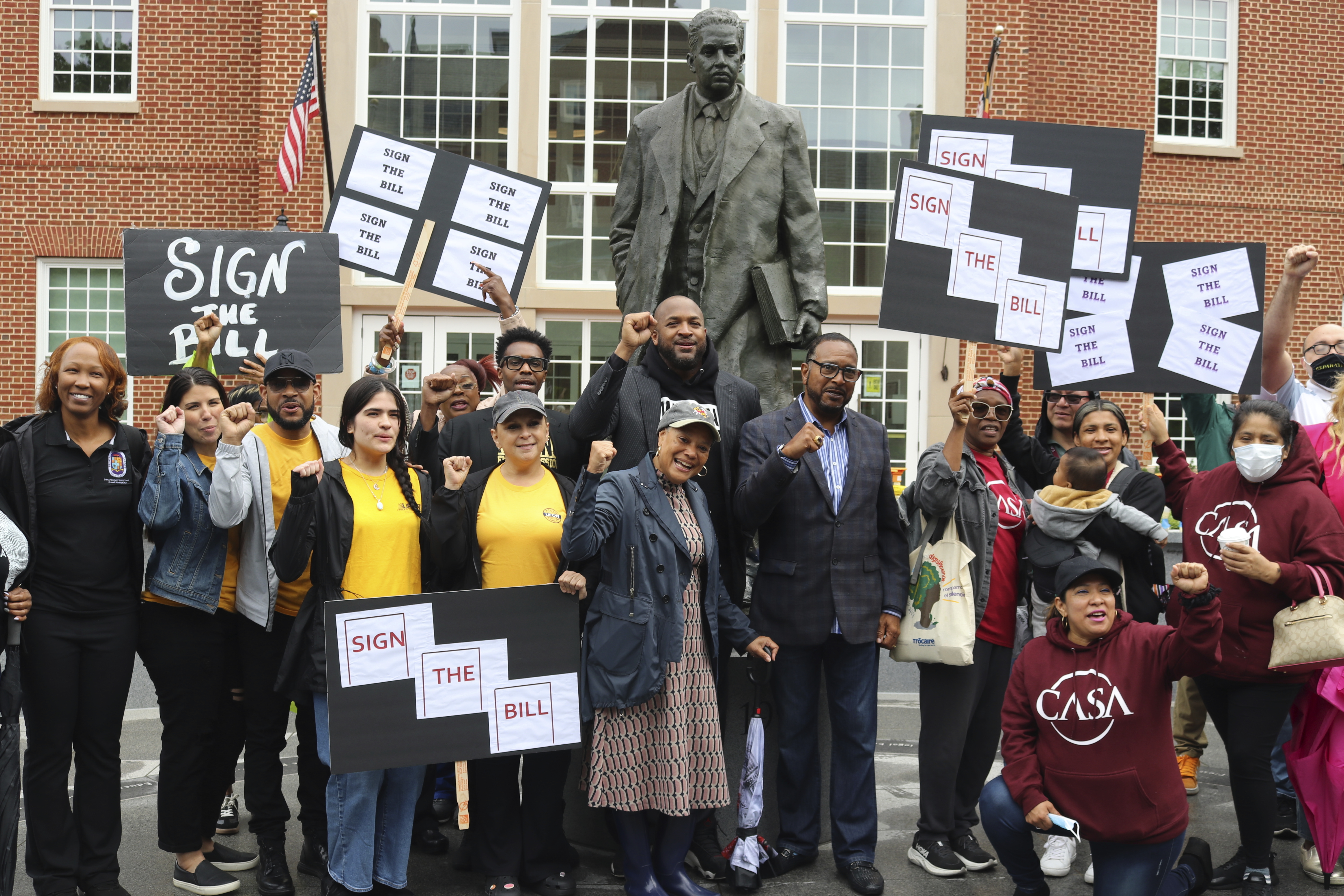 Supporters of a Maryland measure to create a commission to study potential reparations for slavery rally on Friday, May 9, 2025 in Annapolis, Md., next to a statute of former Supreme Court Justice Thurgood Marshall. (AP Photo/Brian Witte)