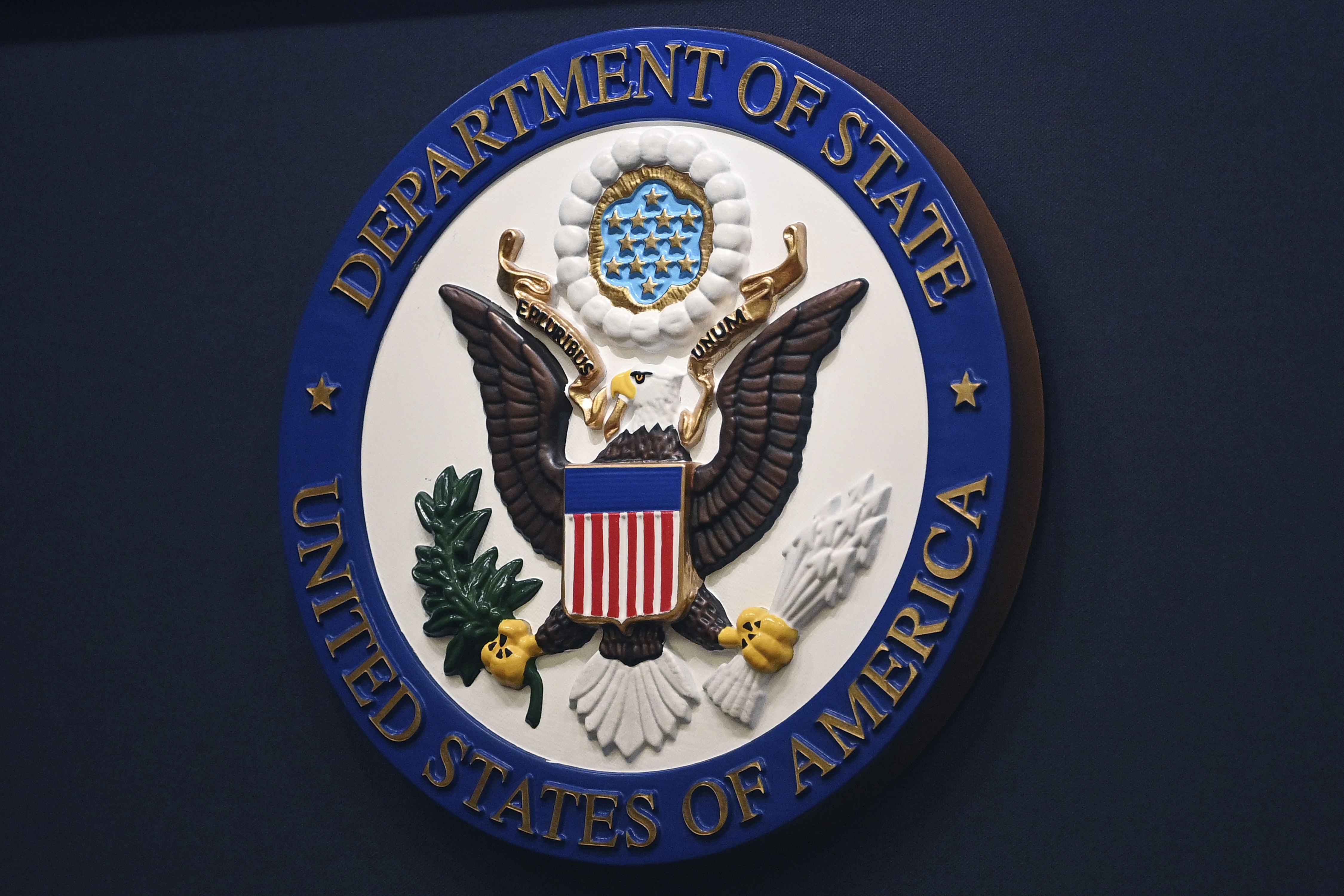 FILE - The State Department seal is seen on the briefing room lectern at the State Department in Washington, Jan. 31, 2022.(Mandel Ngan, Pool via AP, File)