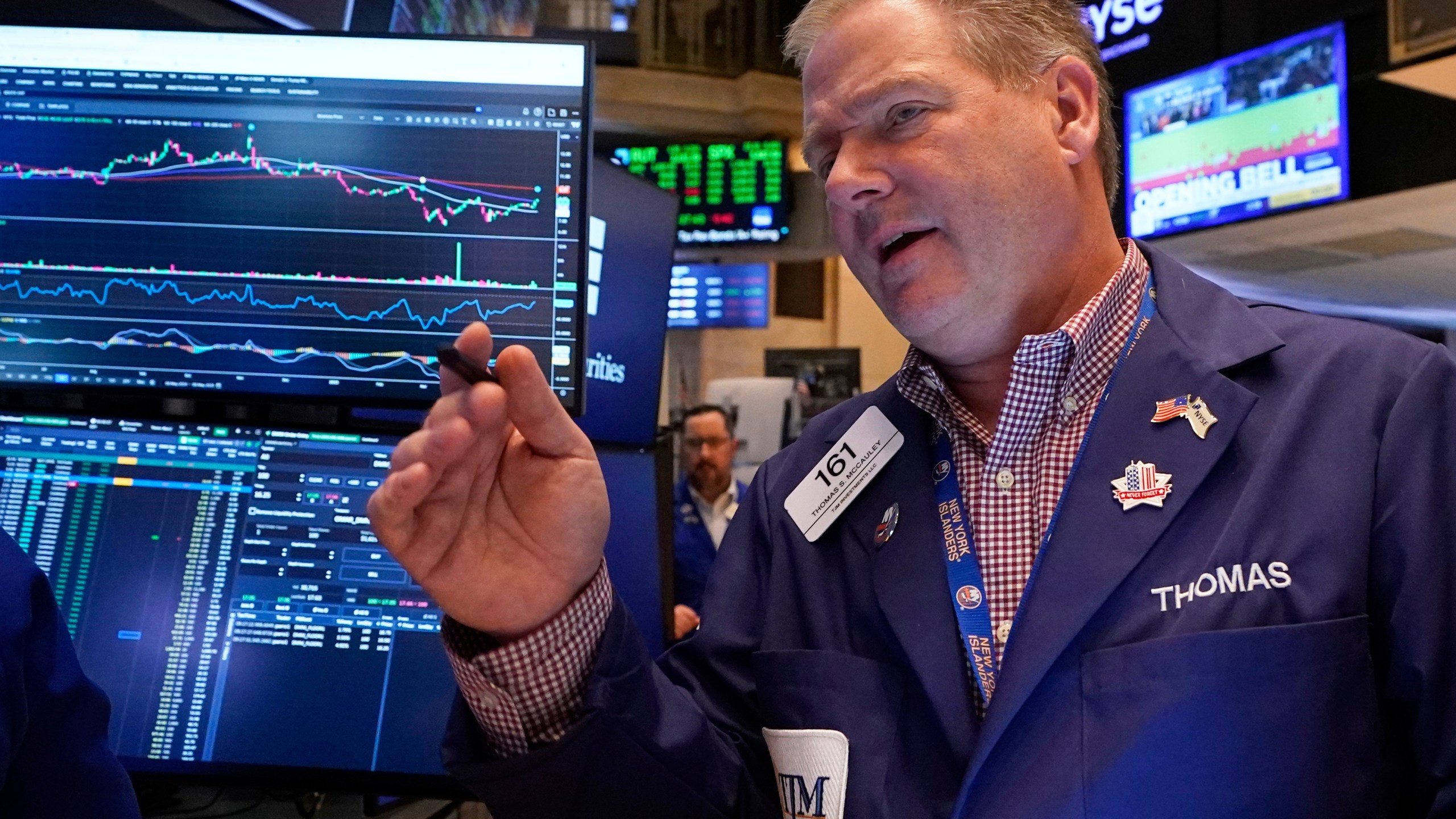 Trader Thomas McCauley works on the floor of the New York Stock Exchange, Friday, May 9, 2025. (AP Photo/Richard Drew)