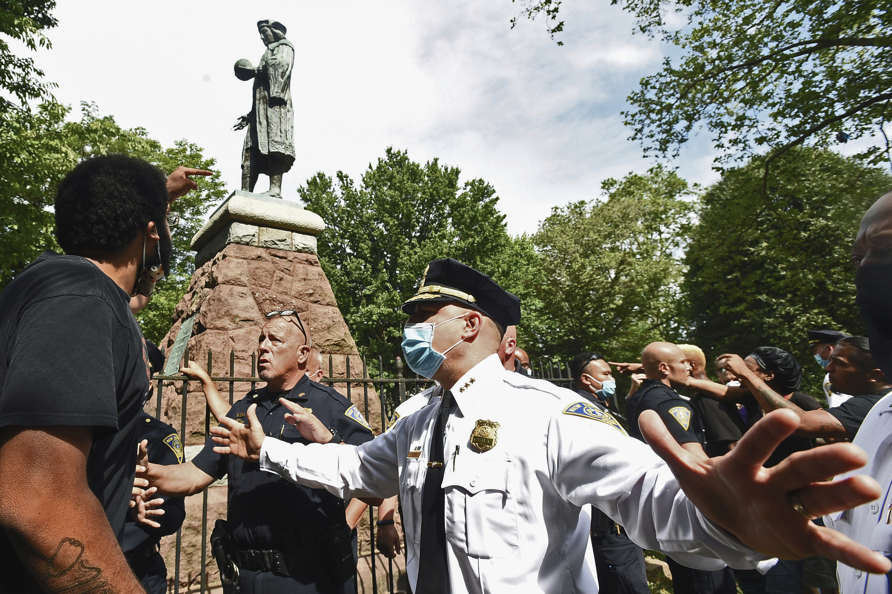 FILE - The statue of Christopher Columbus is removed from Wooster Square Park in New Haven, Conn., on Wednesday, June 24, 2020. (Peter Hvizdak/Hearst Connecticut Media via AP, File)