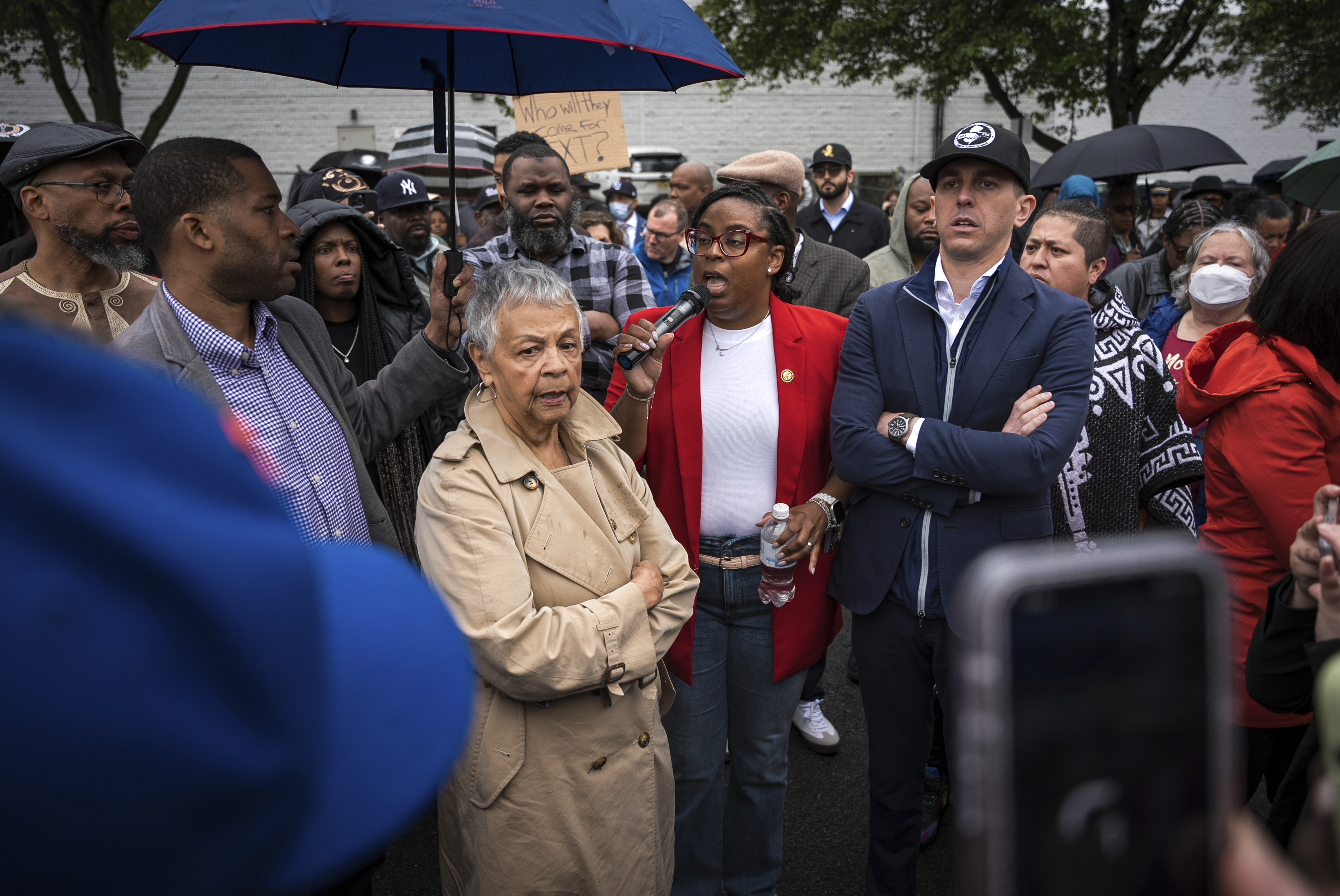 Rep. LaMonica McIver, center, demands the release of Newark Mayor Ras Baraka after his arrest while protesting outside an ICE detention prison, Friday, May 9, 2025, in Newark, N.J, (AP Photo/Angelina Katsanis)