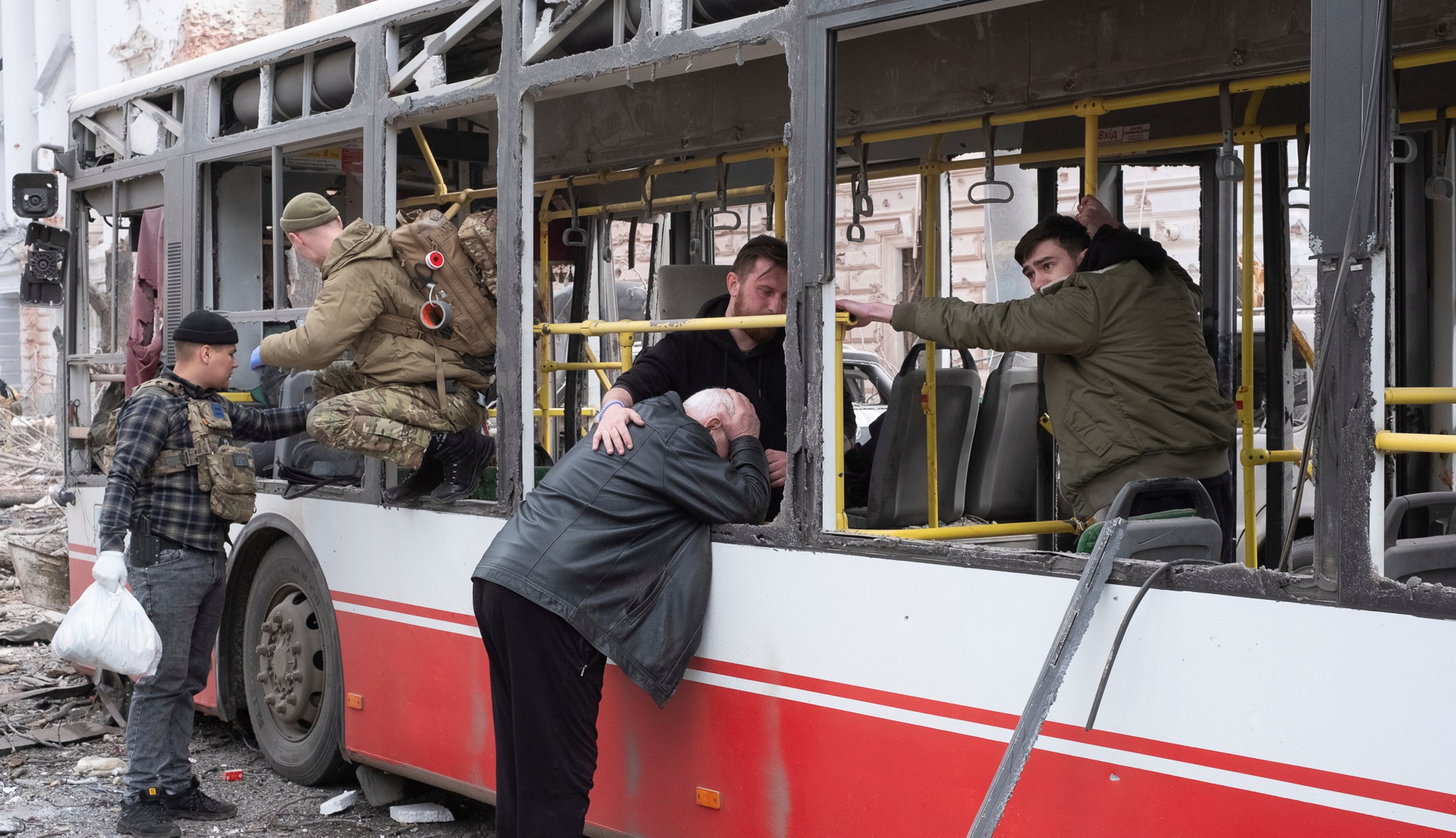 FILE- A man cries at the trolleybus after a Russian missile strike on Sumy, Ukraine, April 13, 2025. (AP Photo/Volodymyr Hordiienko, file)