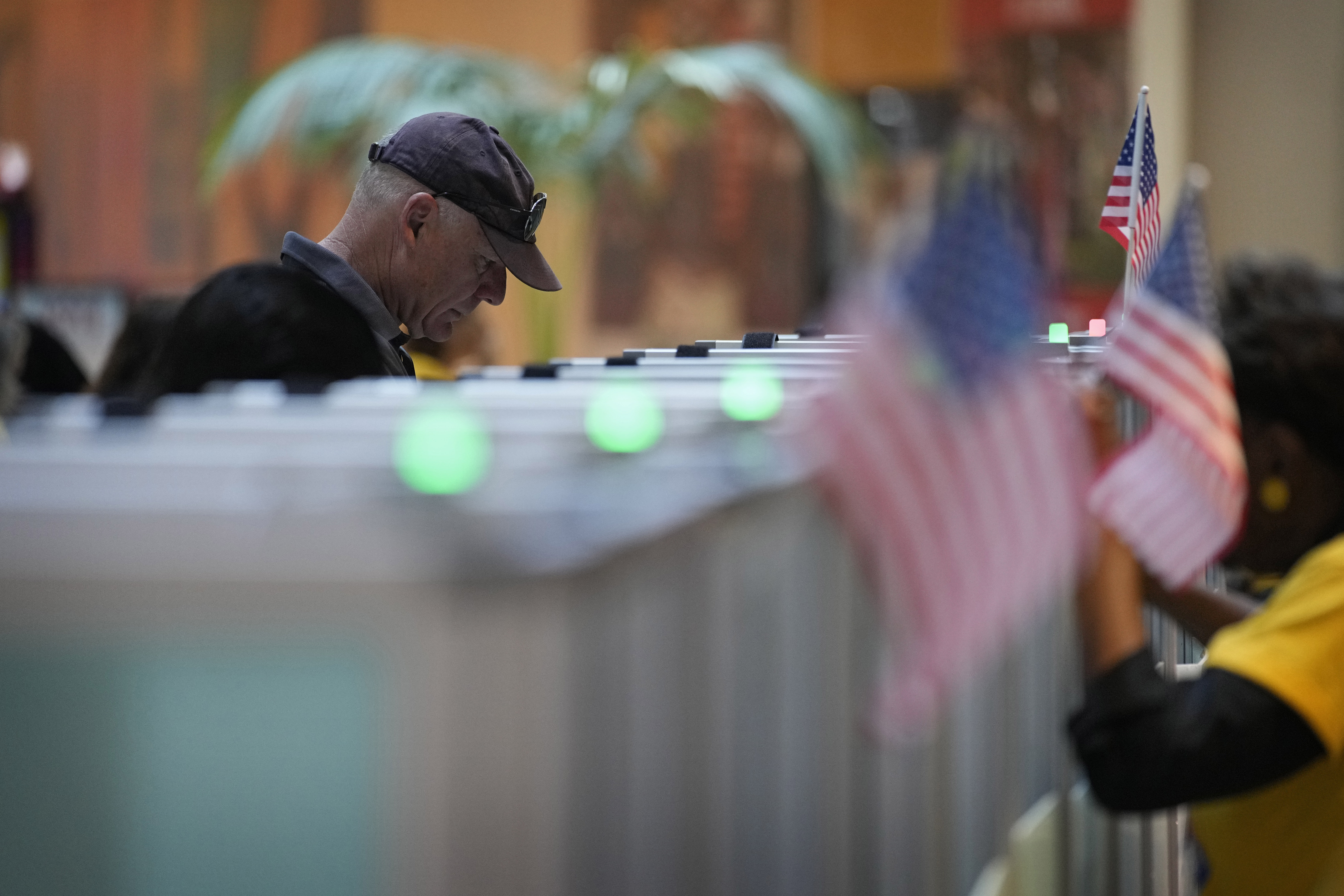 FILE - A person votes in the Nevada primary at a polling place, June 11, 2024, in Henderson, Nev. (AP Photo/John Locher, File)