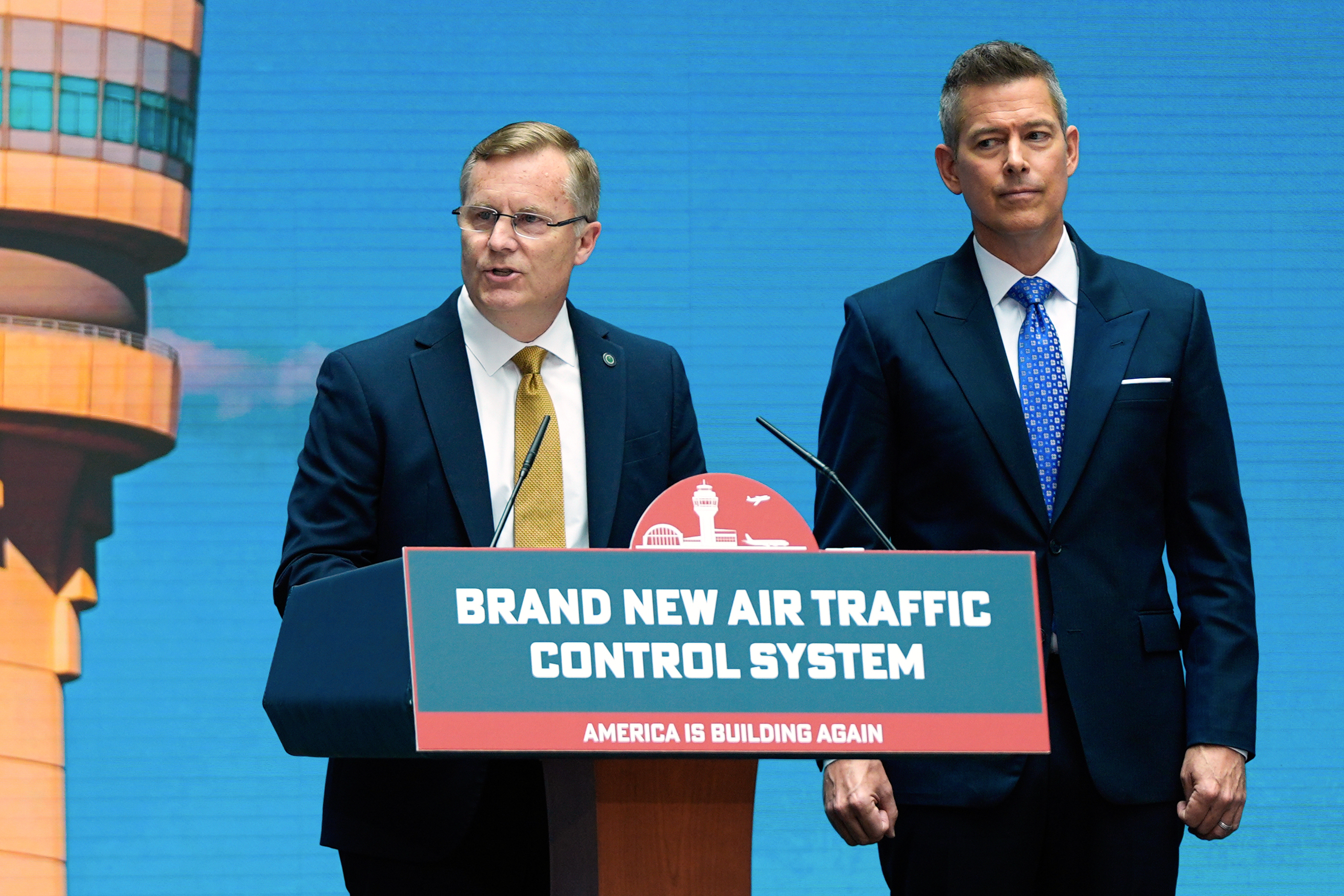 Chris Rocheleau, acting administrator of the Federal Aviation Administration, left, and Transportation Secretary Sean Duffy, right, speak about a new air traffic control infrastructure plan, Thursday, May 8, 2025, in Washington. (AP Photo/Julia Demaree Nikhinson)