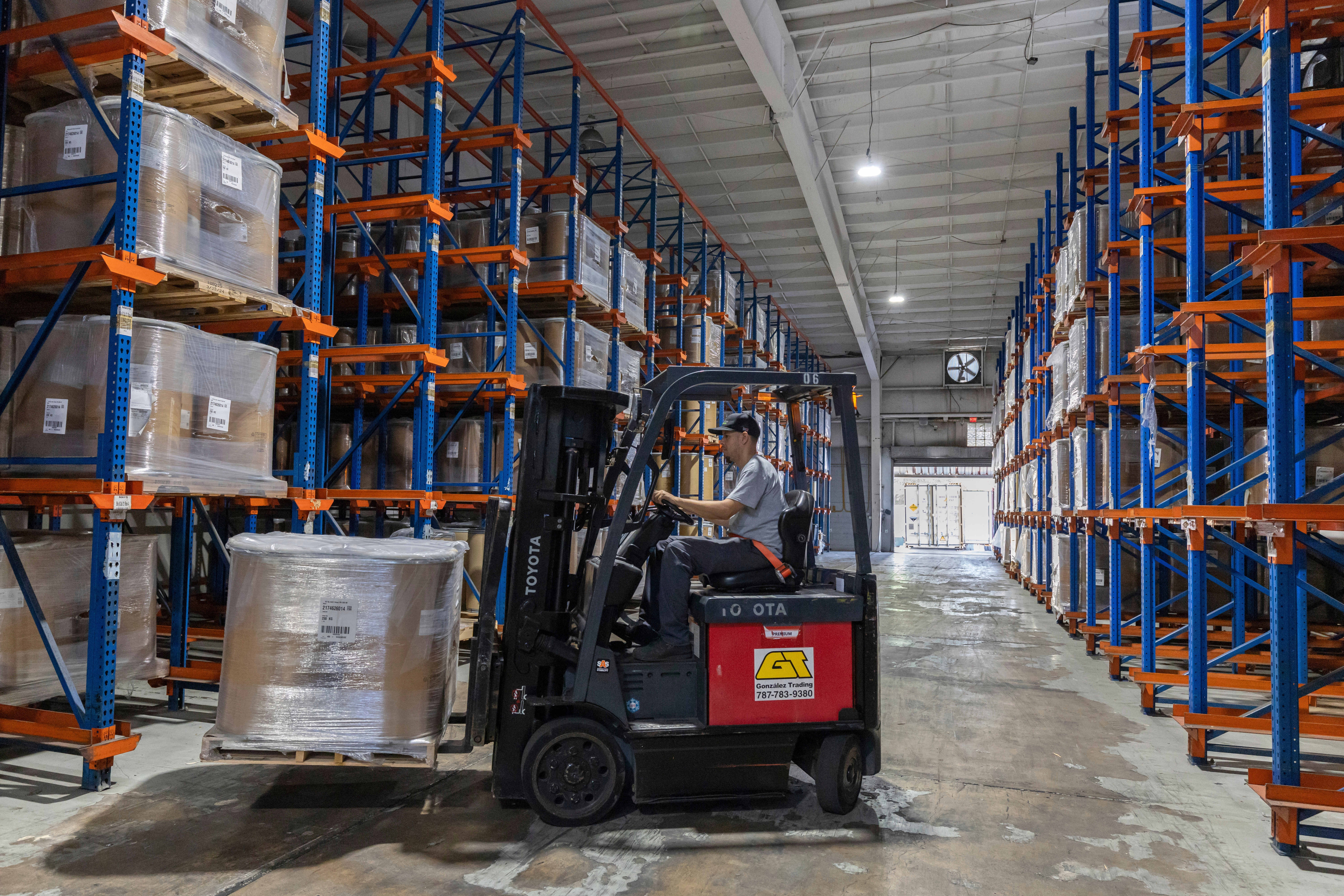 A forklift worker transports goods at a warehouse in San Juan, Puerto Rico, Thursday, May 8, 2025. (AP Photo/Alejandro Granadillo)