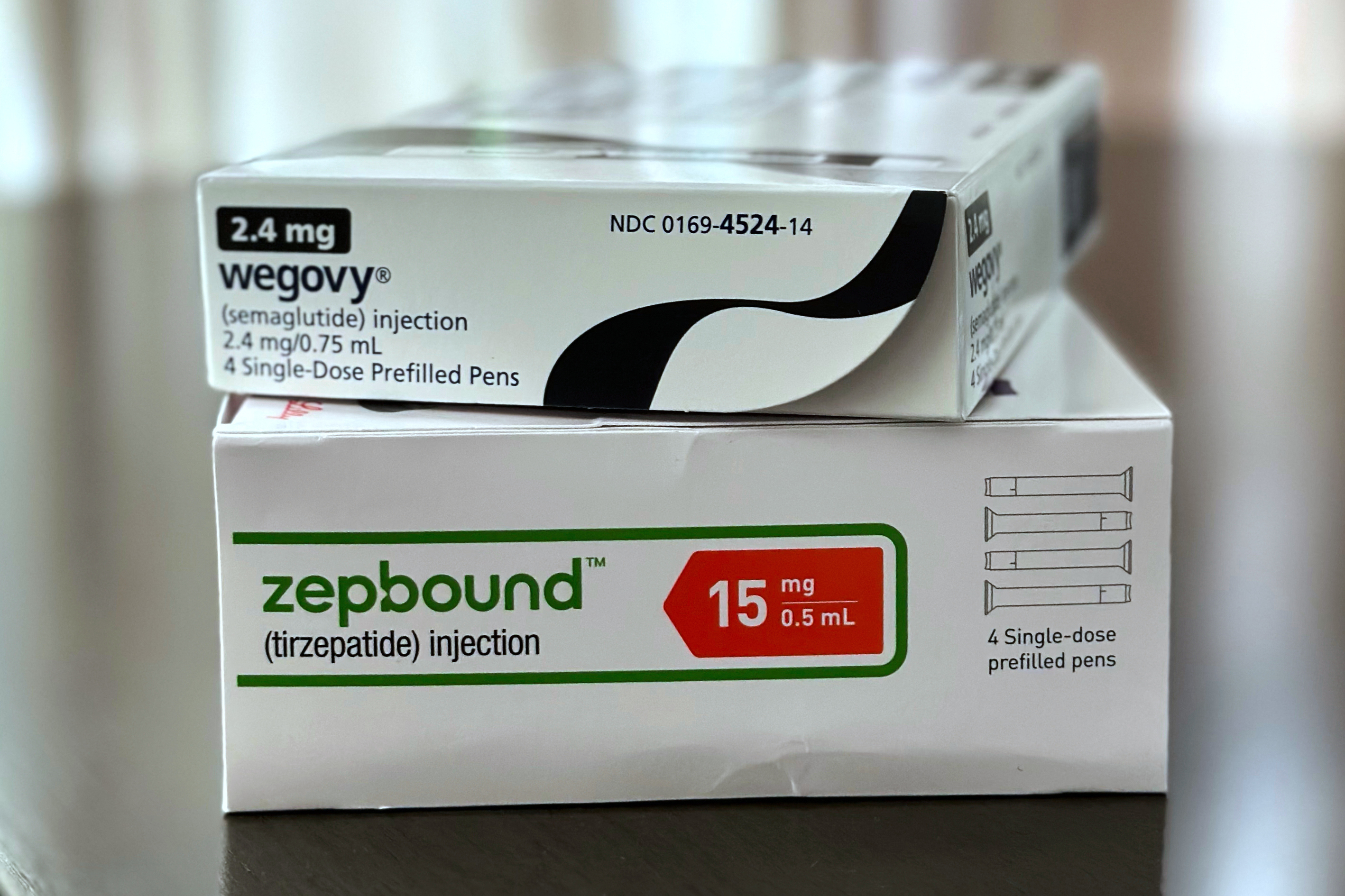 Boxes for the medications Wegovy and Zepbound are arranged for a photograph in California on Thursday, May 8, 2025. (AP Photo/JoNel Aleccia)
