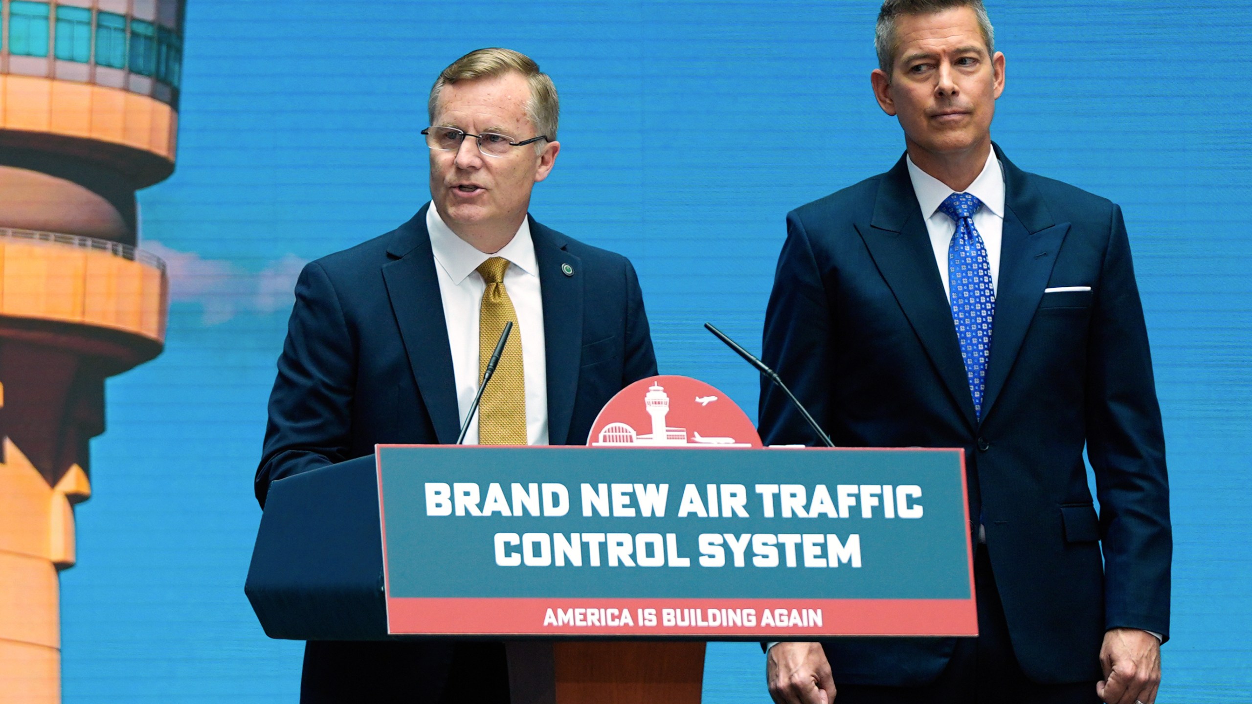 Chris Rocheleau, acting administrator of the Federal Aviation Administration, left, and Transportation Secretary Sean Duffy, right, speak about a new air traffic control infrastructure plan, Thursday, May 8, 2025, in Washington. (AP Photo/Julia Demaree Nikhinson)