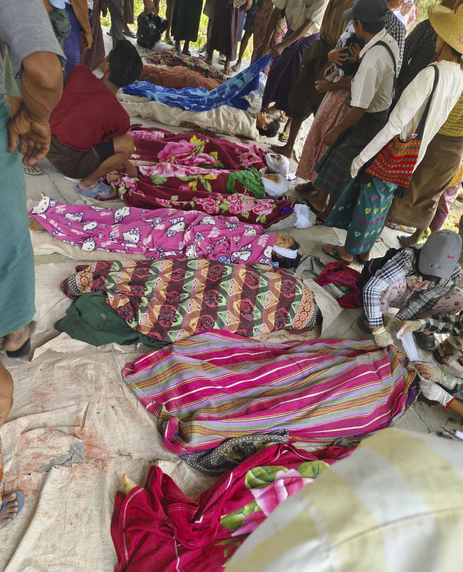 EDS NOTE GRAPHIC CONTENT- Bodies of victims, killed in an alleged hit by a military airstrike, are laid on the ground in Ohe Htein Twin village in Tabayin township, also known as Depayin in Sagaing region, Myanmar, Monday, May 12, 2025. (White Depeyin People Defence Force via AP)