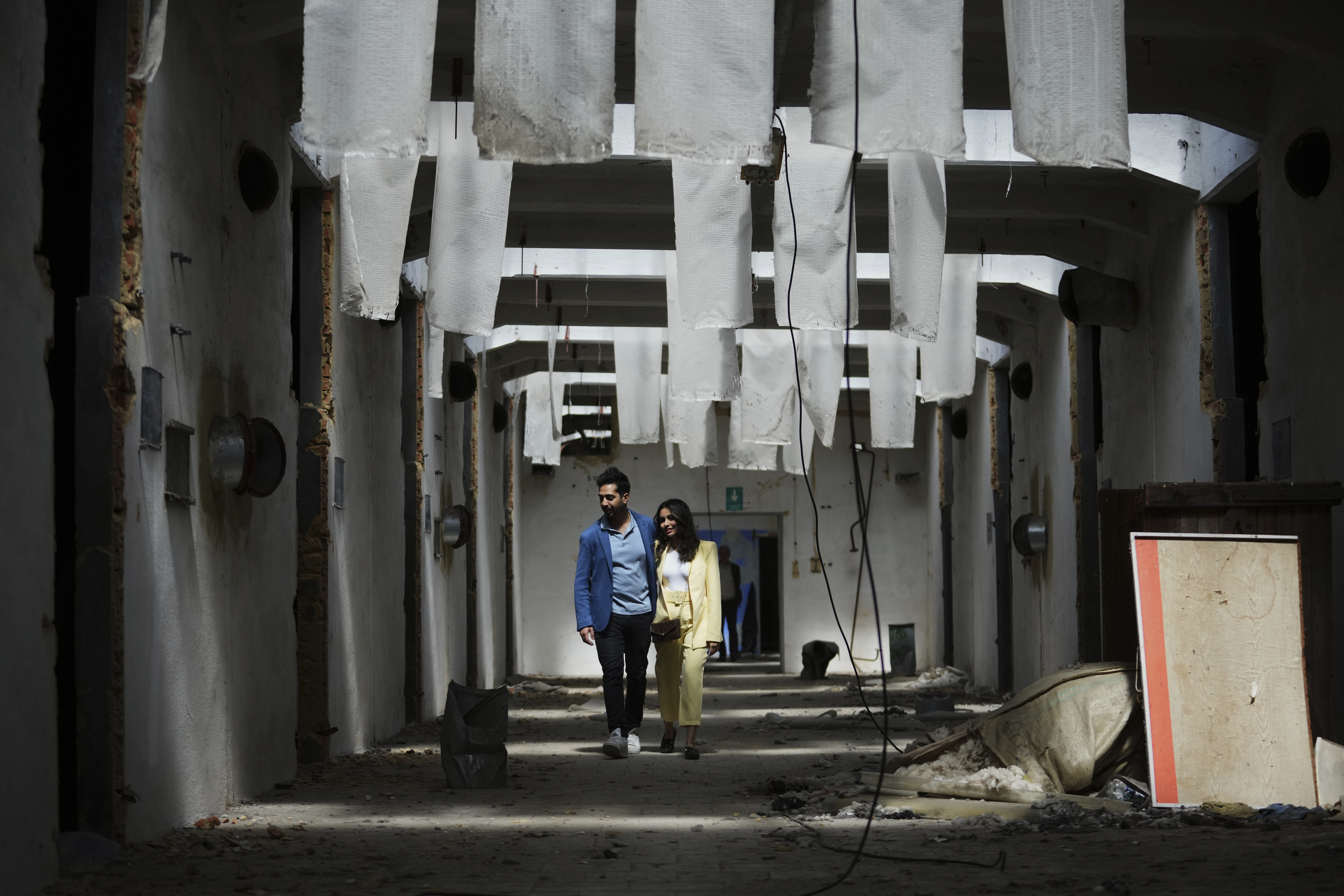 Visitors observe the Museum of Survivors, located in a factory where Oskar Schindler saved some 1200 Jews during the WWII, in Brnenec, Czech Republic, Saturday, May 10, 2025. (AP Photo/Petr David Josek)