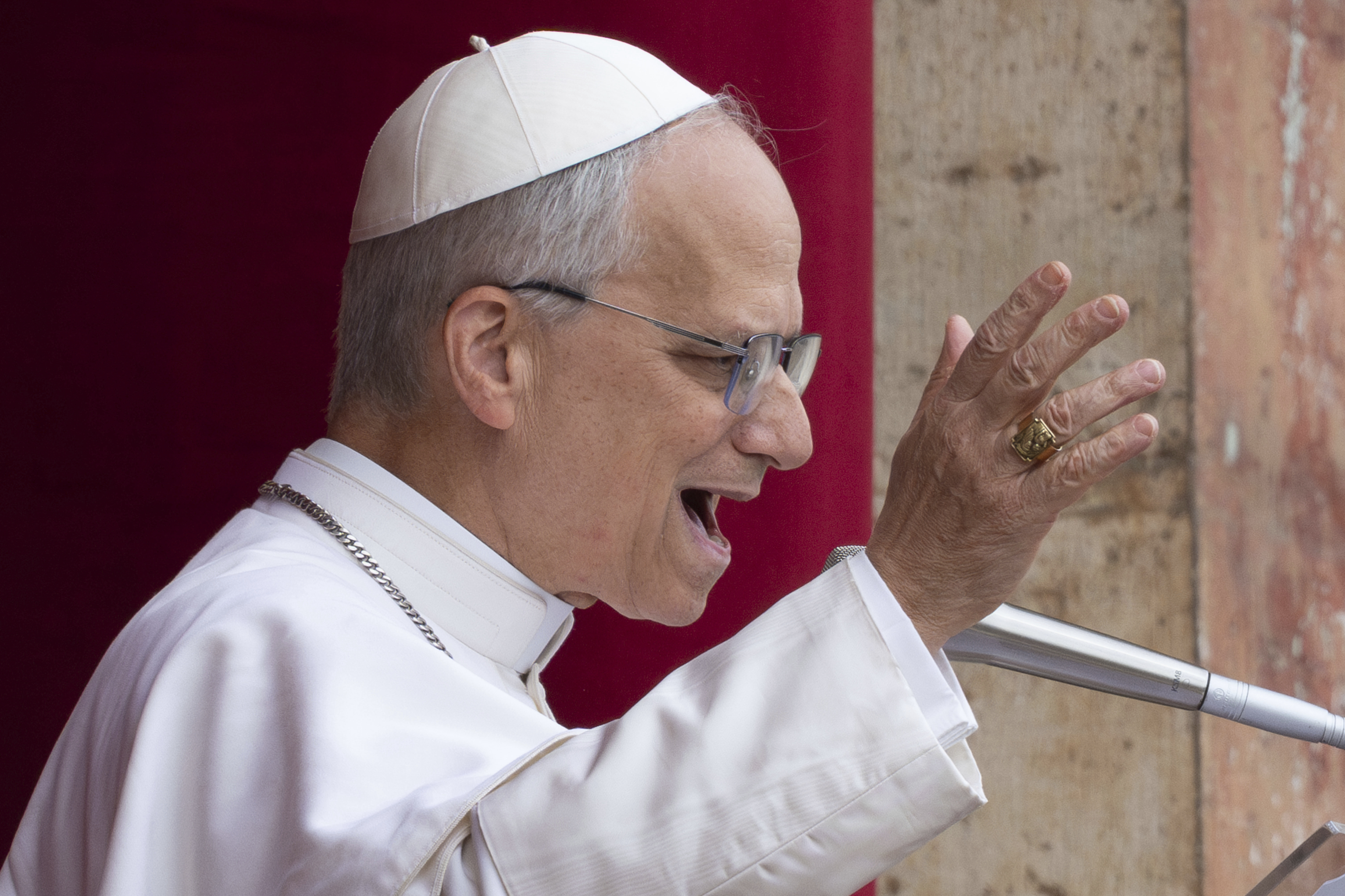 FILE- Pope Leo XIV speaks from the central balcony of St. Peter's Basilica on Sunday, May 11, 2025. (AP Photo/Domenico Stinellis, File)