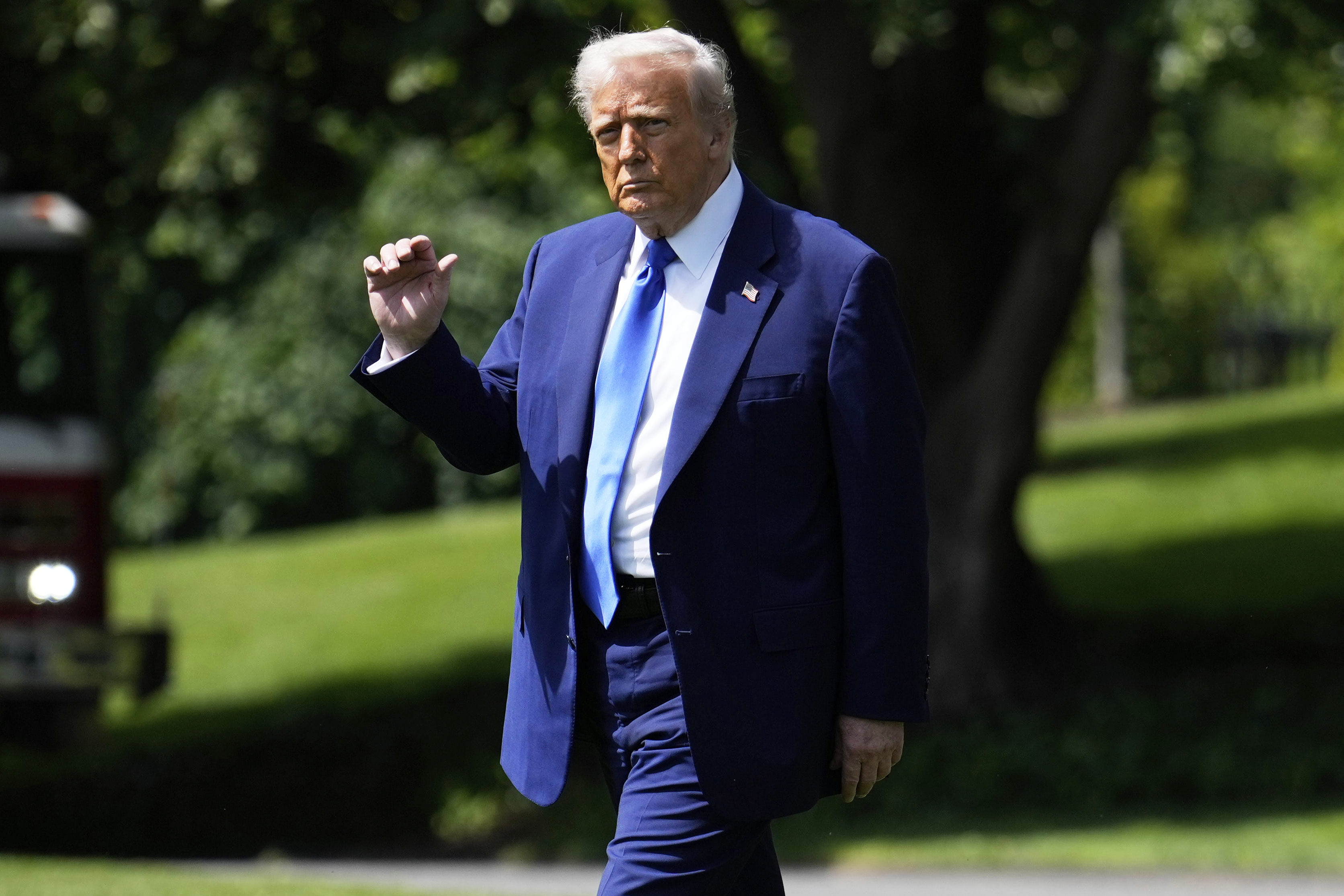 President Donald Trump walks across the South Lawn of the White House to board Marine One en route to Joint Base Andrews, Md., to begin a trip to the Middle East, Monday, May 12, 2025, in Washington. (AP Photo/Mark Schiefelbein)