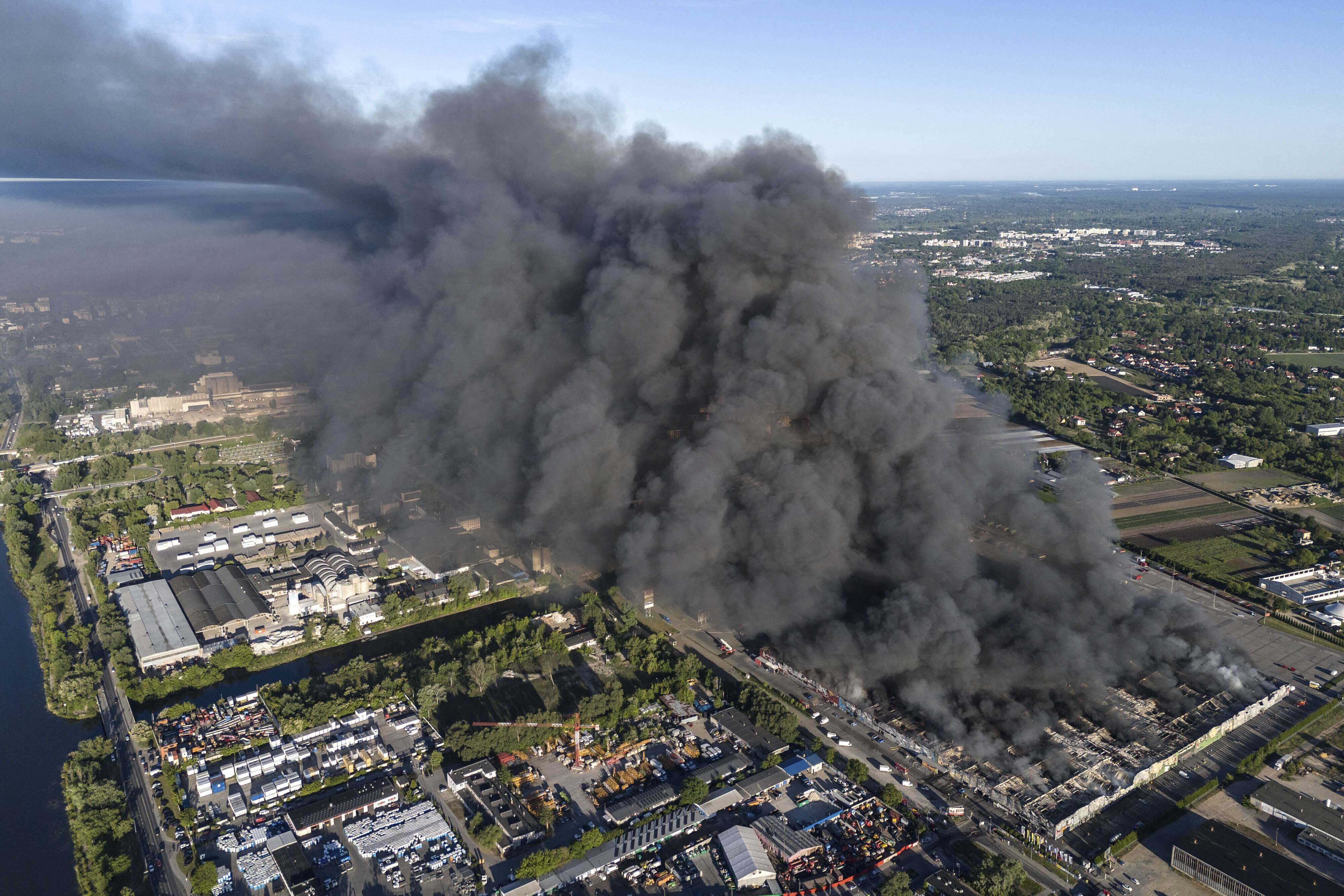 FILE - A fire burns from a vast shopping complex in Warsaw, Poland, May 12, 2024. (AP Photo/Norbert Ofmanski, File)