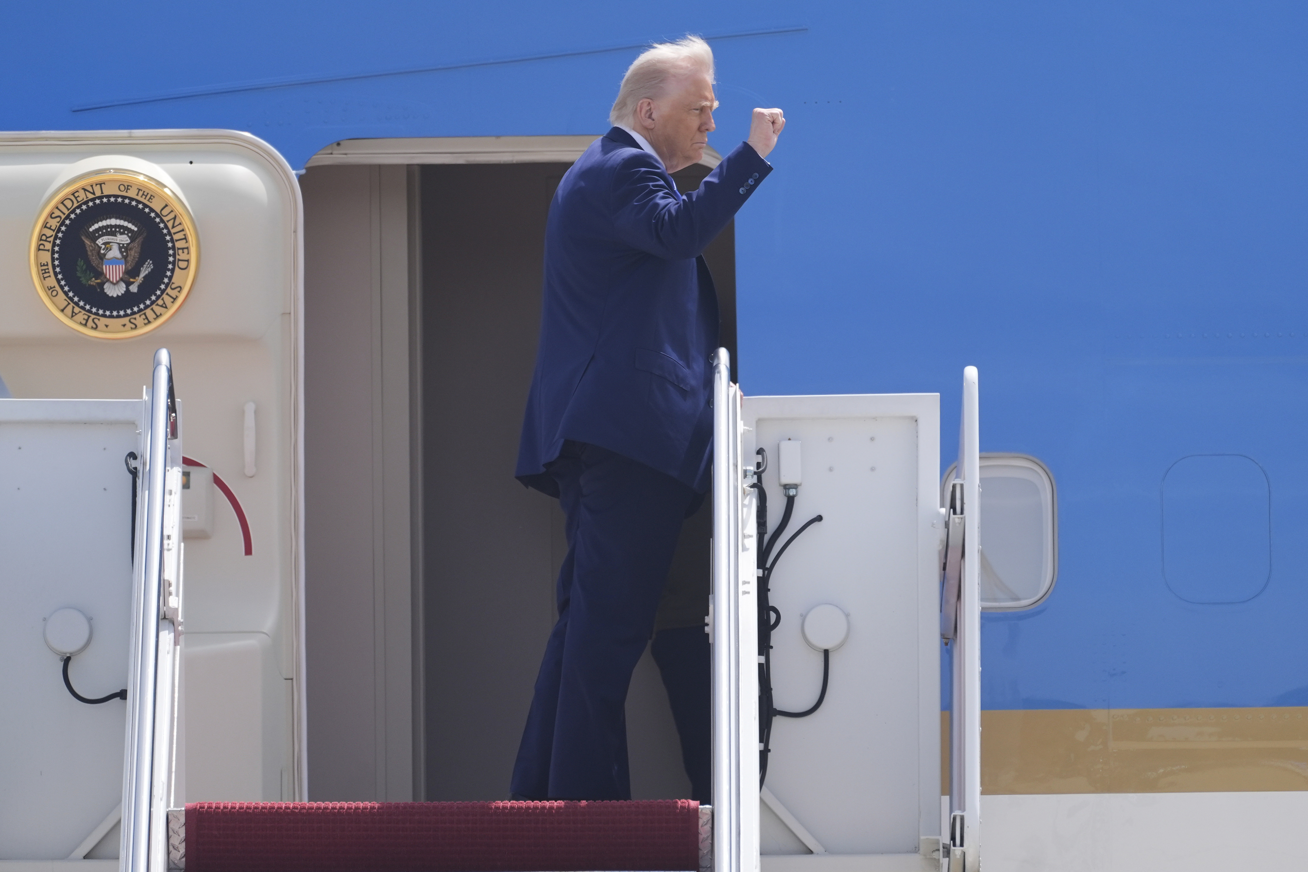 President Donald Trump boards Air Force One at Joint Base Andrews, Md., on his way to Riyadh, Saudi Arabia, Monday, May 12, 2025. (AP Photo/Manuel Balce Ceneta)
