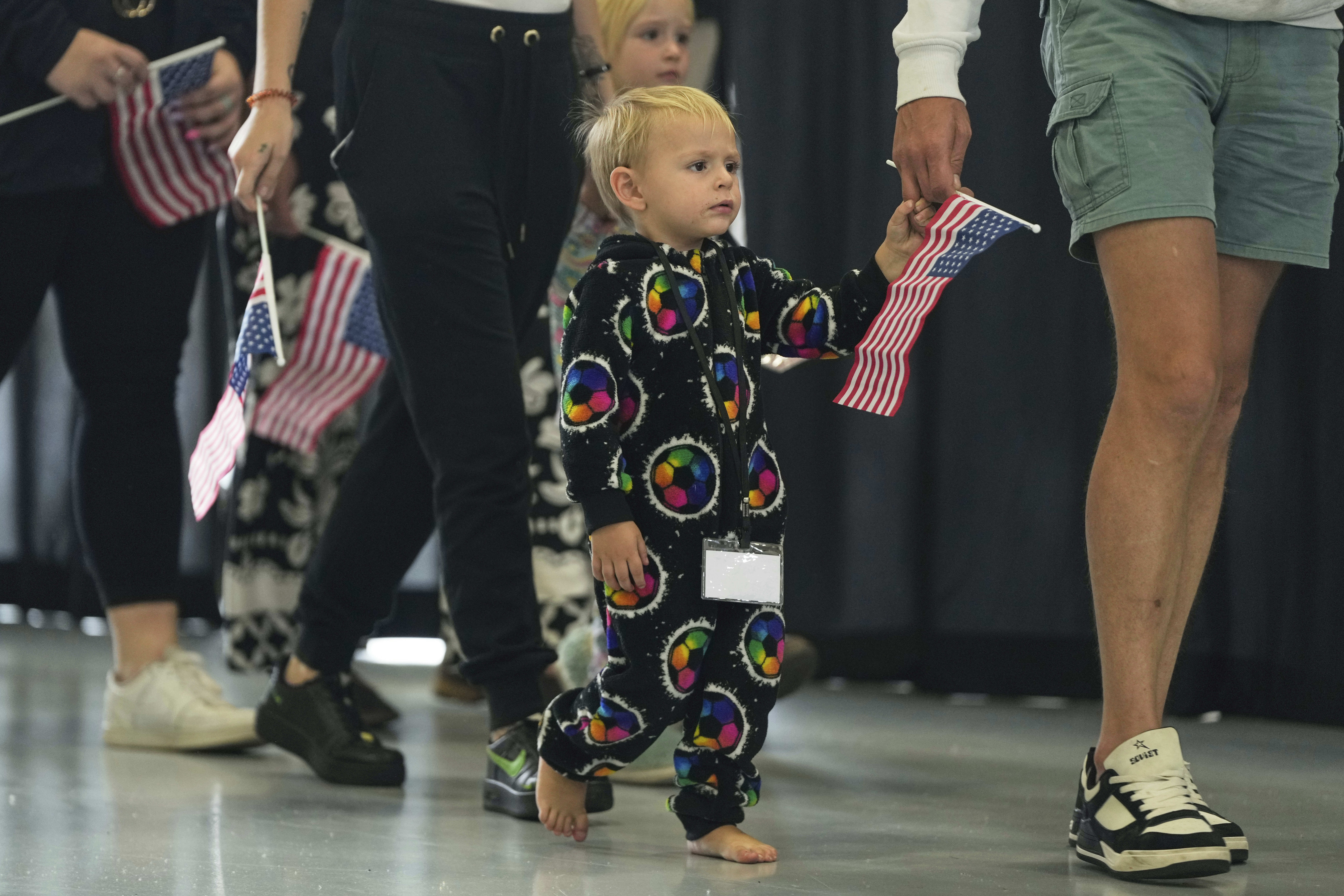 Afrikaner refugees from South Africa arrive, Monday, May 12, 2025, at Dulles International Airport in Dulles, Va. (AP Photo/Julia Demaree Nikhinson)