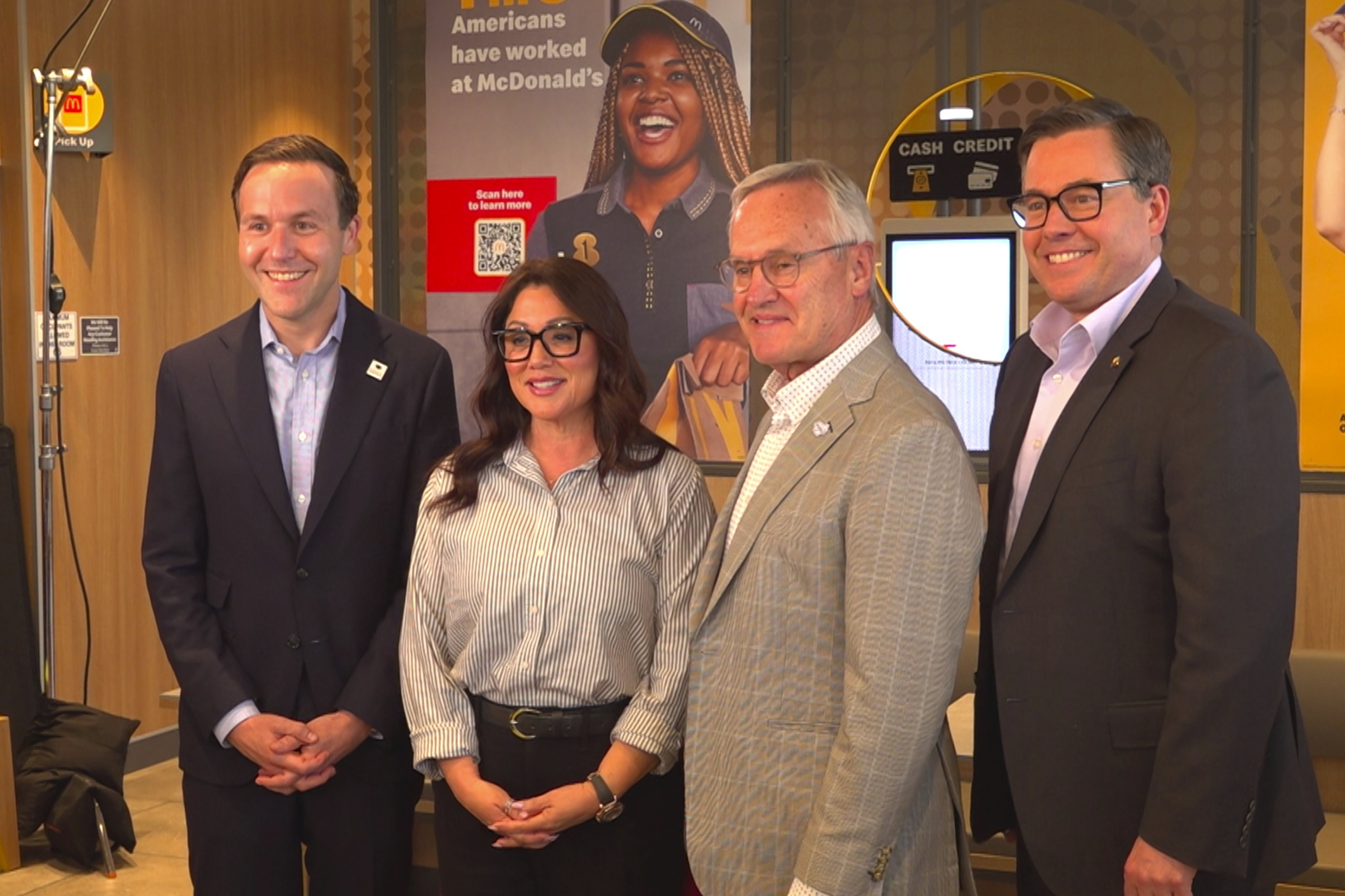 This photo taken from video shows McDonald’s Senior Vice President and Chief Impact Officer of North America Michael Gonda, left, United States Secretary of Labor Lori Chavez-DeRemer, Lt. Gov. of Ohio Jim Tressel and McDonald’s USA President Joe Erlinger inside a McDonald’s restaurant on Monday, May 12, 2025, in Delaware, Ohio. (AP Photo)