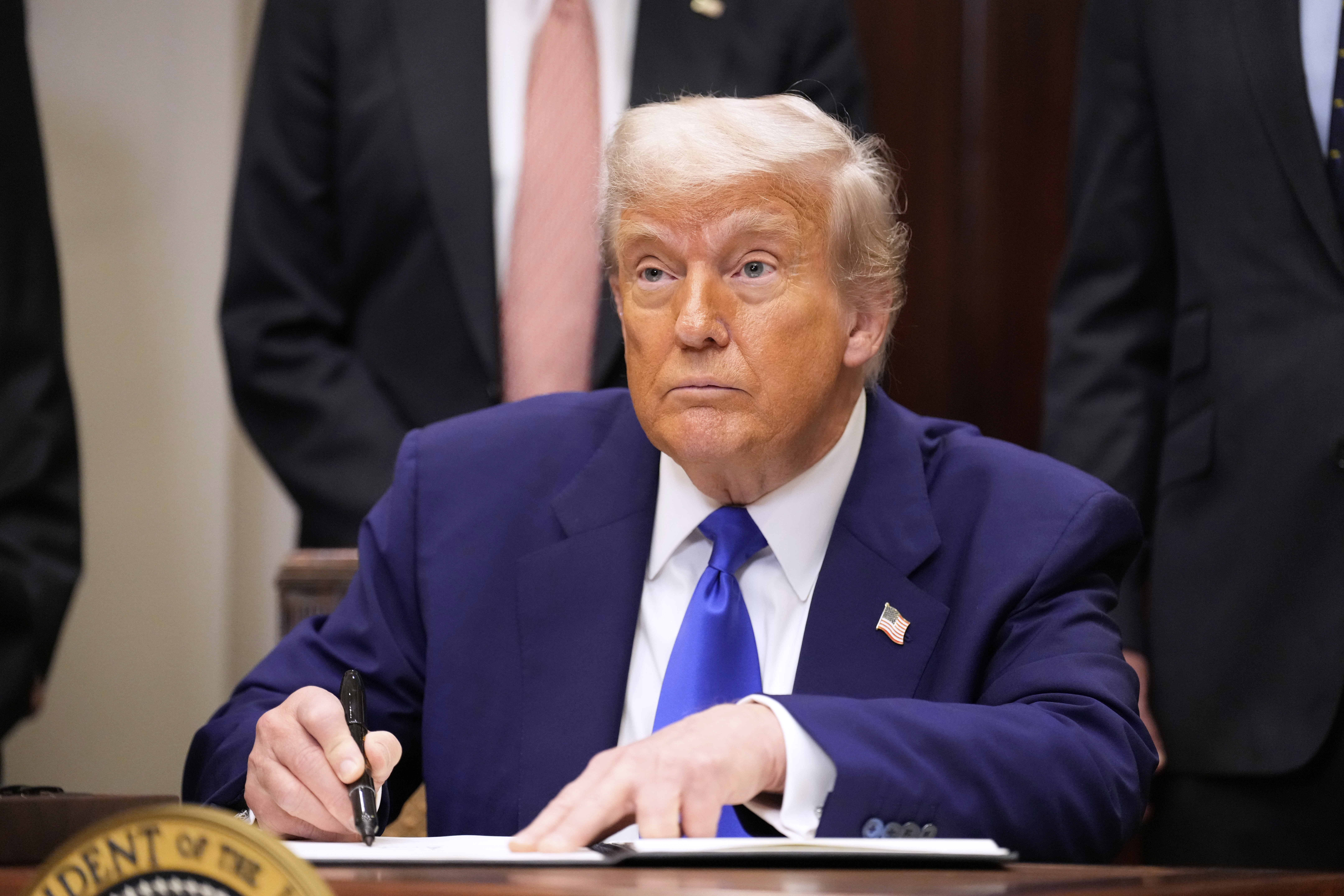 President Donald Trump signs an executive order related to drug prices, in the Roosevelt Room of the White House in Washington, Monday, May 12, 2025, in Washington. (AP Photo/Mark Schiefelbein)