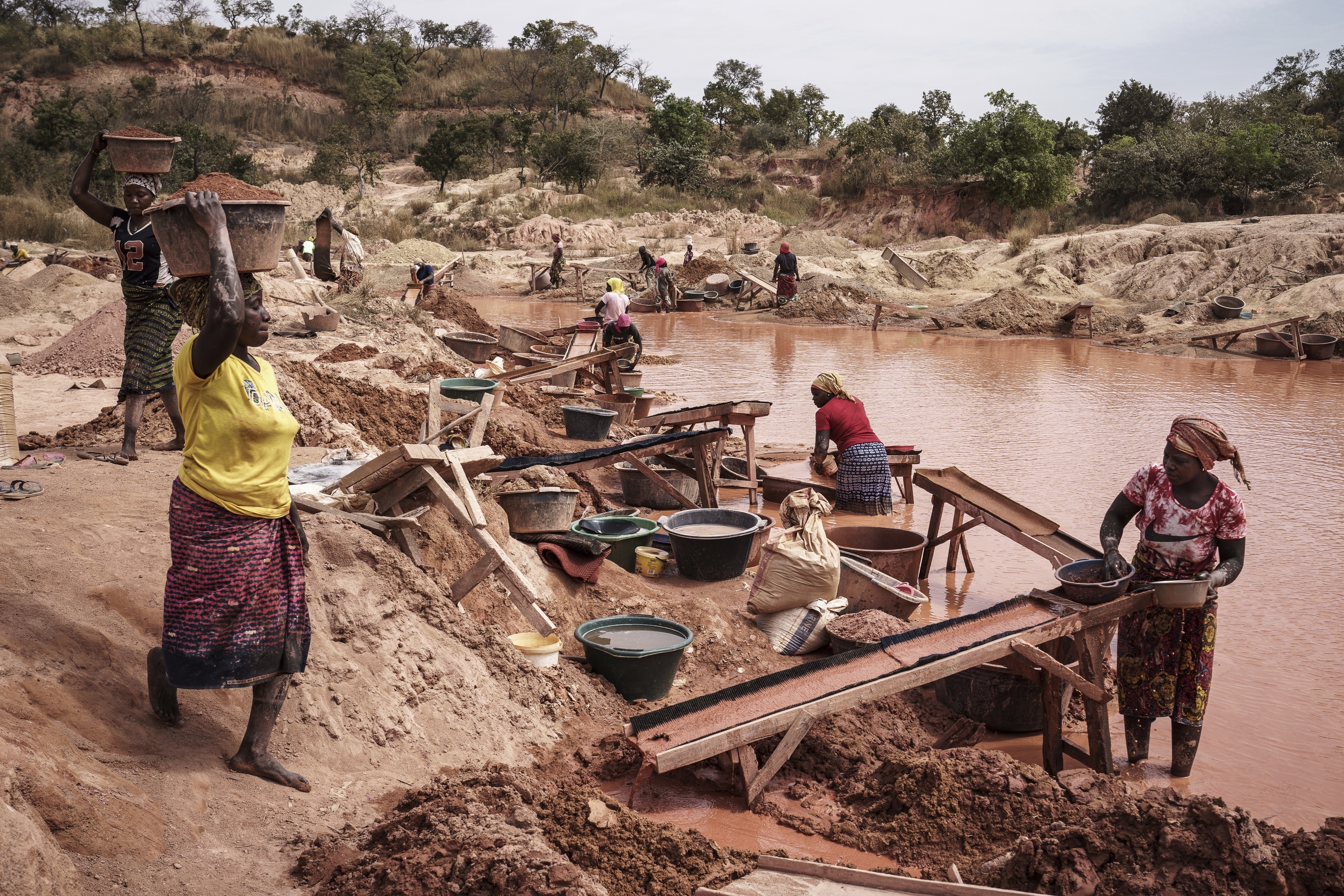 Women process gold at a mining site in the Kedougou region of Senegal on Thursday, Jan. 16, 2025. (AP Photo/Annika Hammerschlag)
