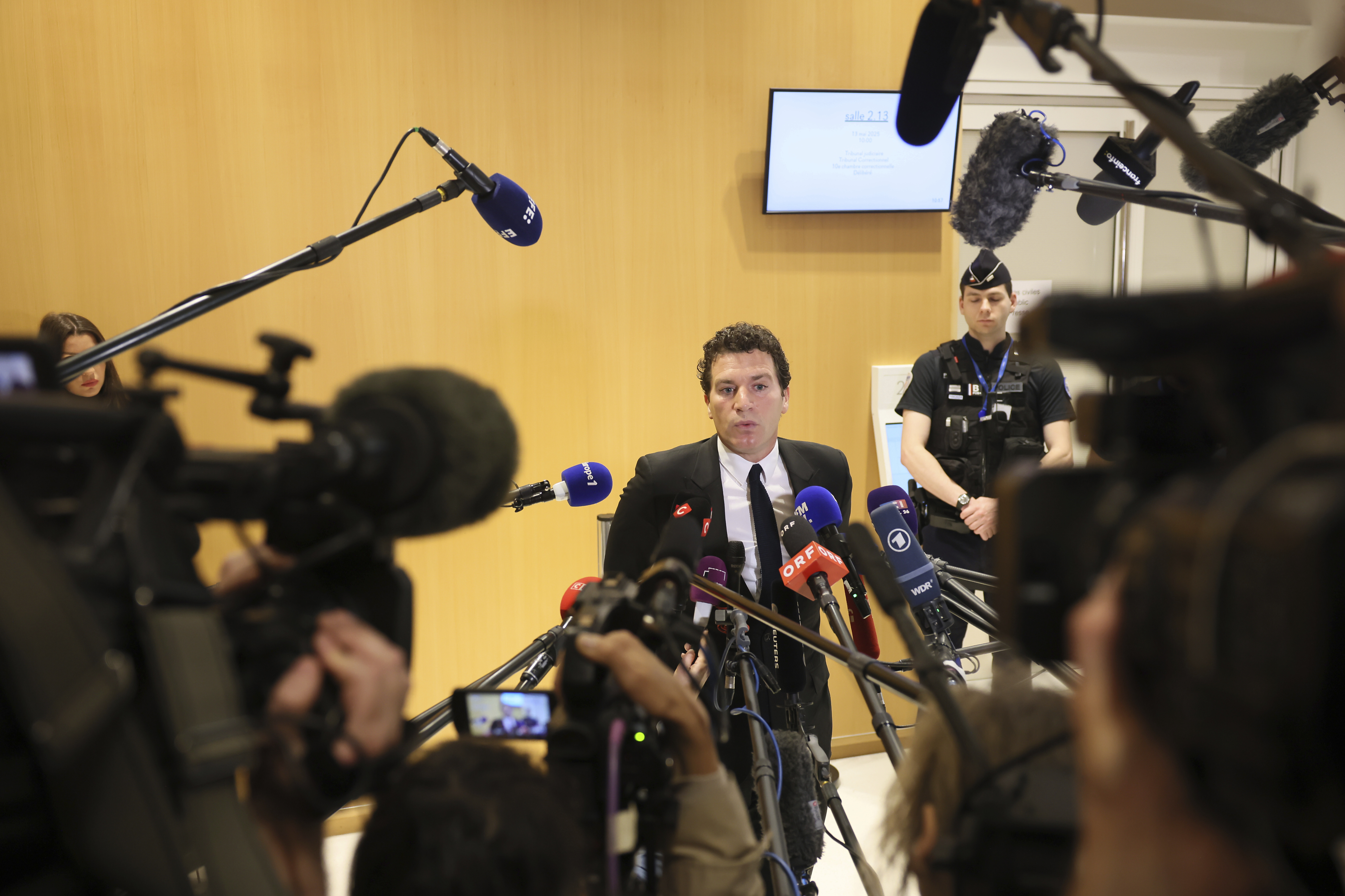 French actor Gerard Depardieu's lawyer Jeremie Assous speaks with the media after a verdict was delivered on accusations that the actor sexually assaulted two women who were working on a film with him in 2021, in Paris, Tuesday, May 13, 2025. (AP Photo/Thomas Padilla)