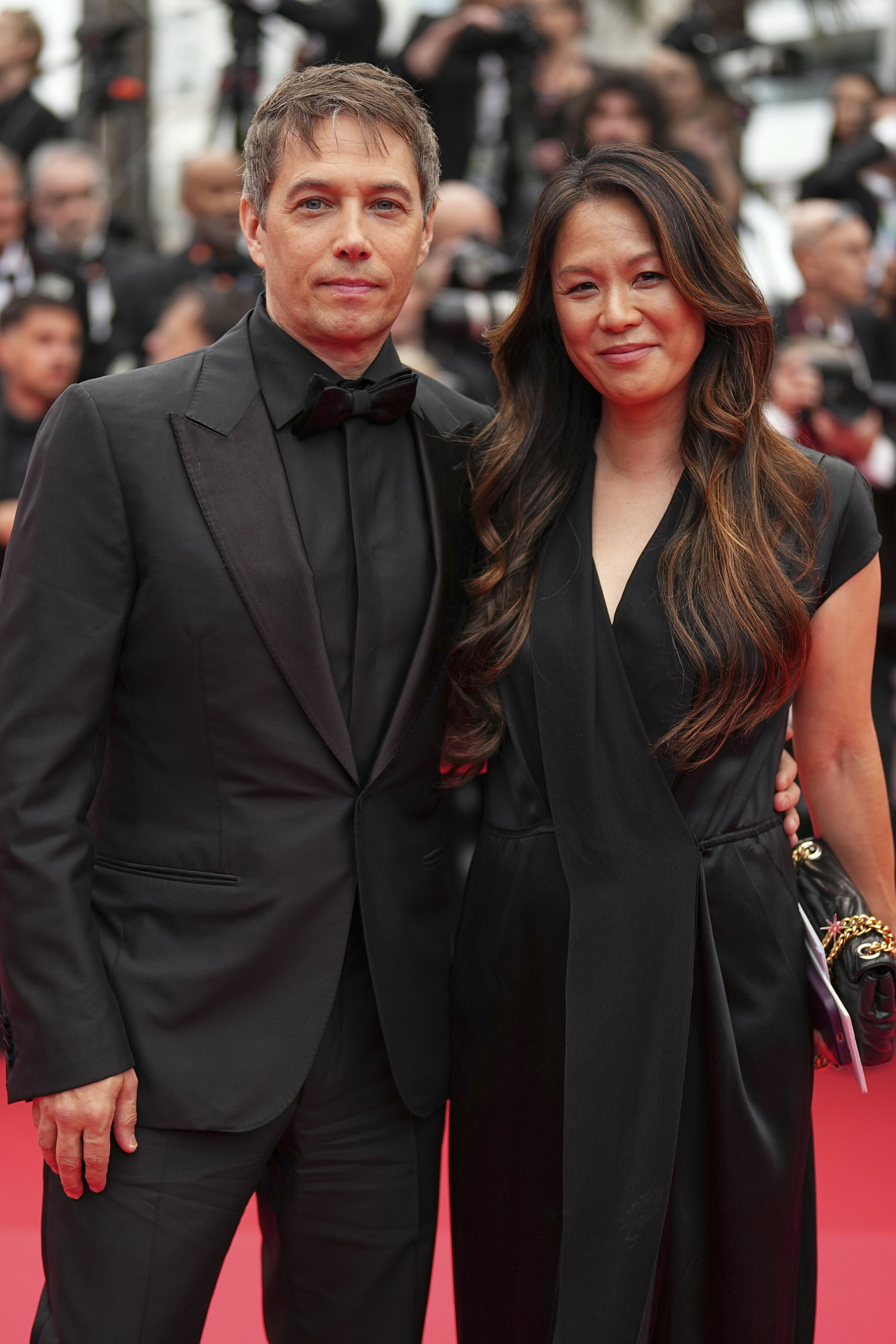 Sean Baker, left, and Samantha Quan pose for photographers during the opening ceremony red carpet of the 78th international film festival, Cannes, southern France, Tuesday, May 13, 2025. (Photo by Scott A Garfitt/Invision/AP)