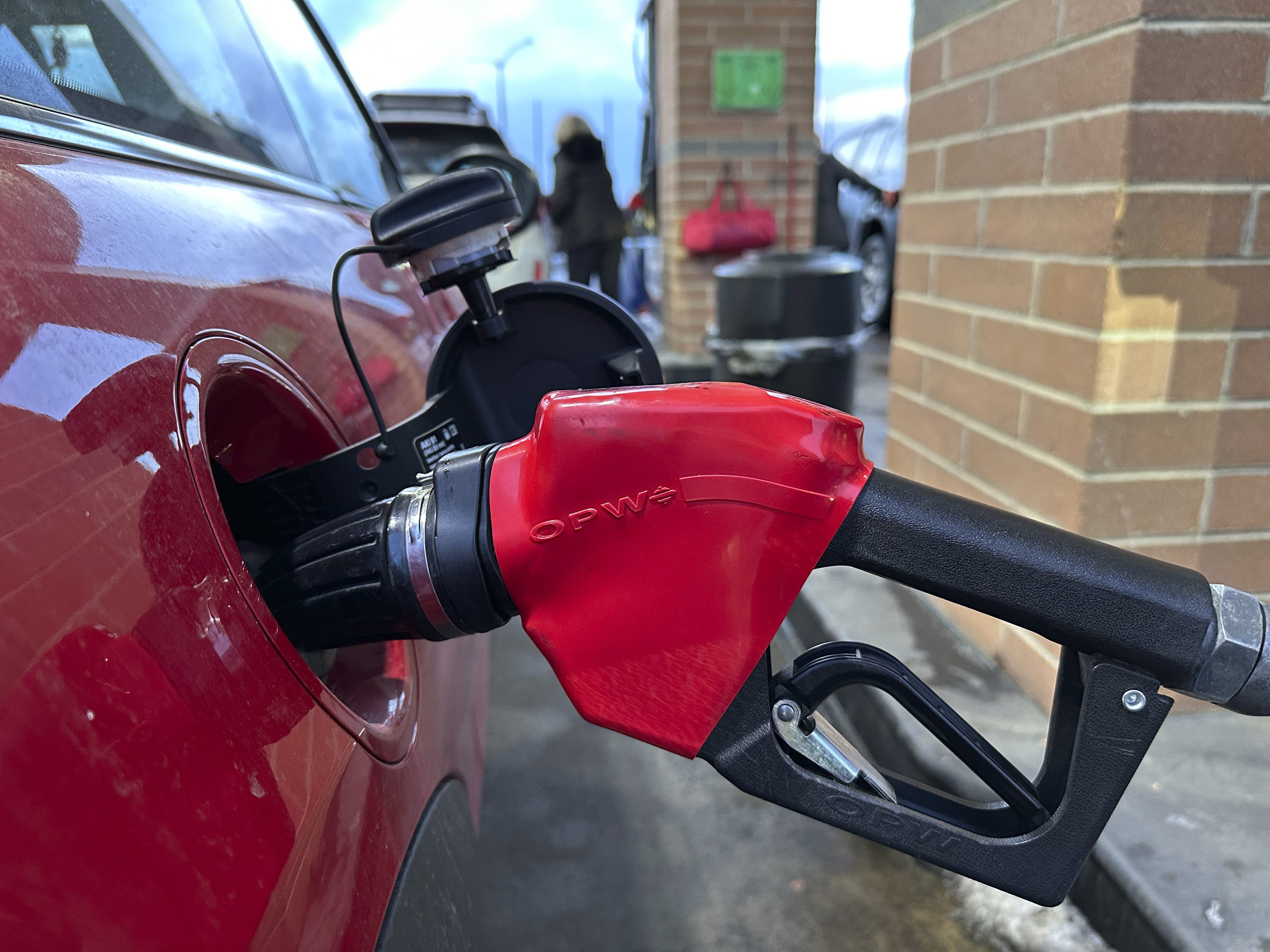 FILE - A motorist fills up the tank of a vehicle at a Costco gasoline station late Sunday, Feb. 16, 2025, in Sheridan, Colo. (AP Photo/David Zalubowski, File)