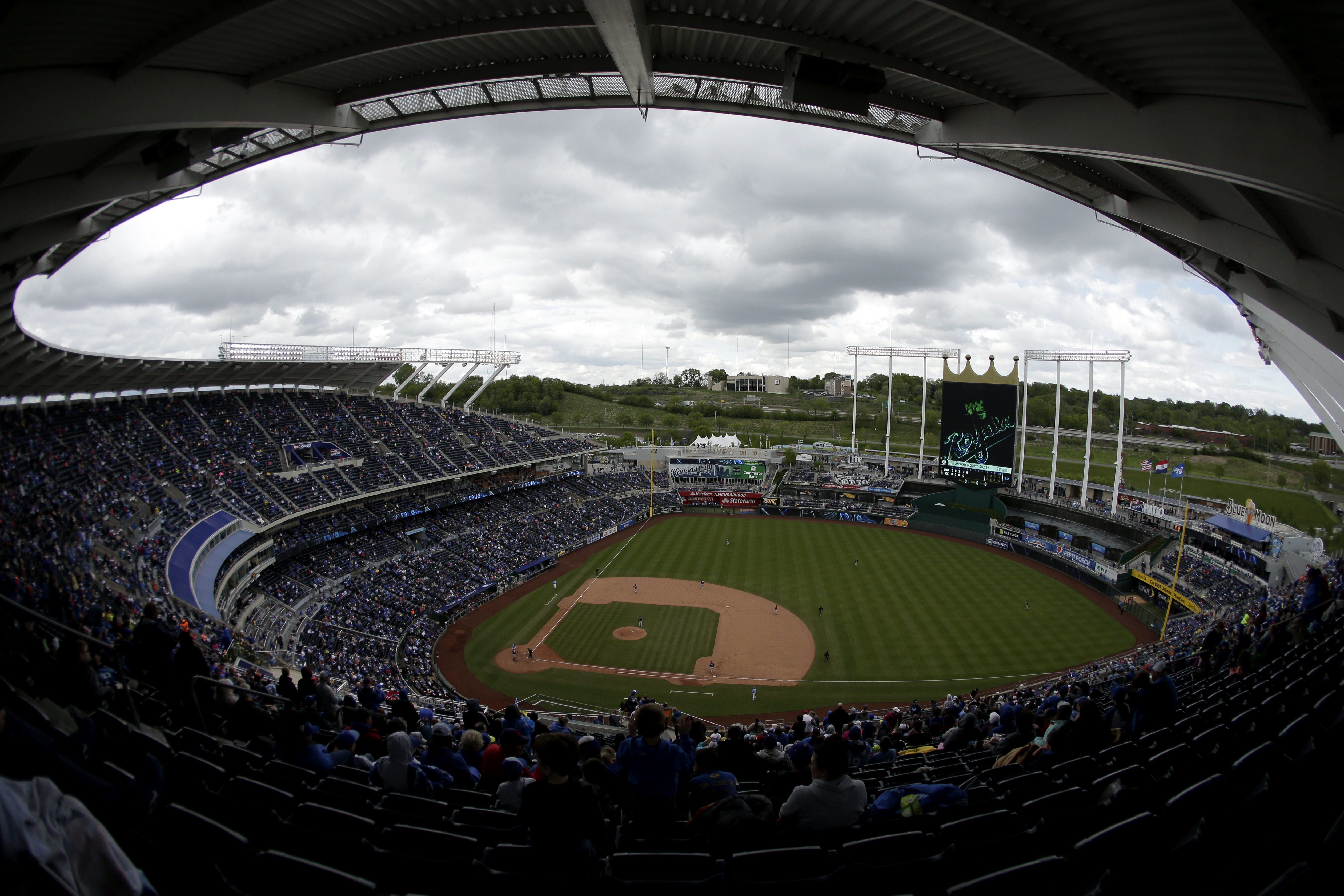 FILE - Fans watch during a baseball game between the Kansas City Royals and the Minnesota Twins Sunday, April 30, 2017, in Kansas City, Mo. (AP Photo/Charlie Riedel, File)