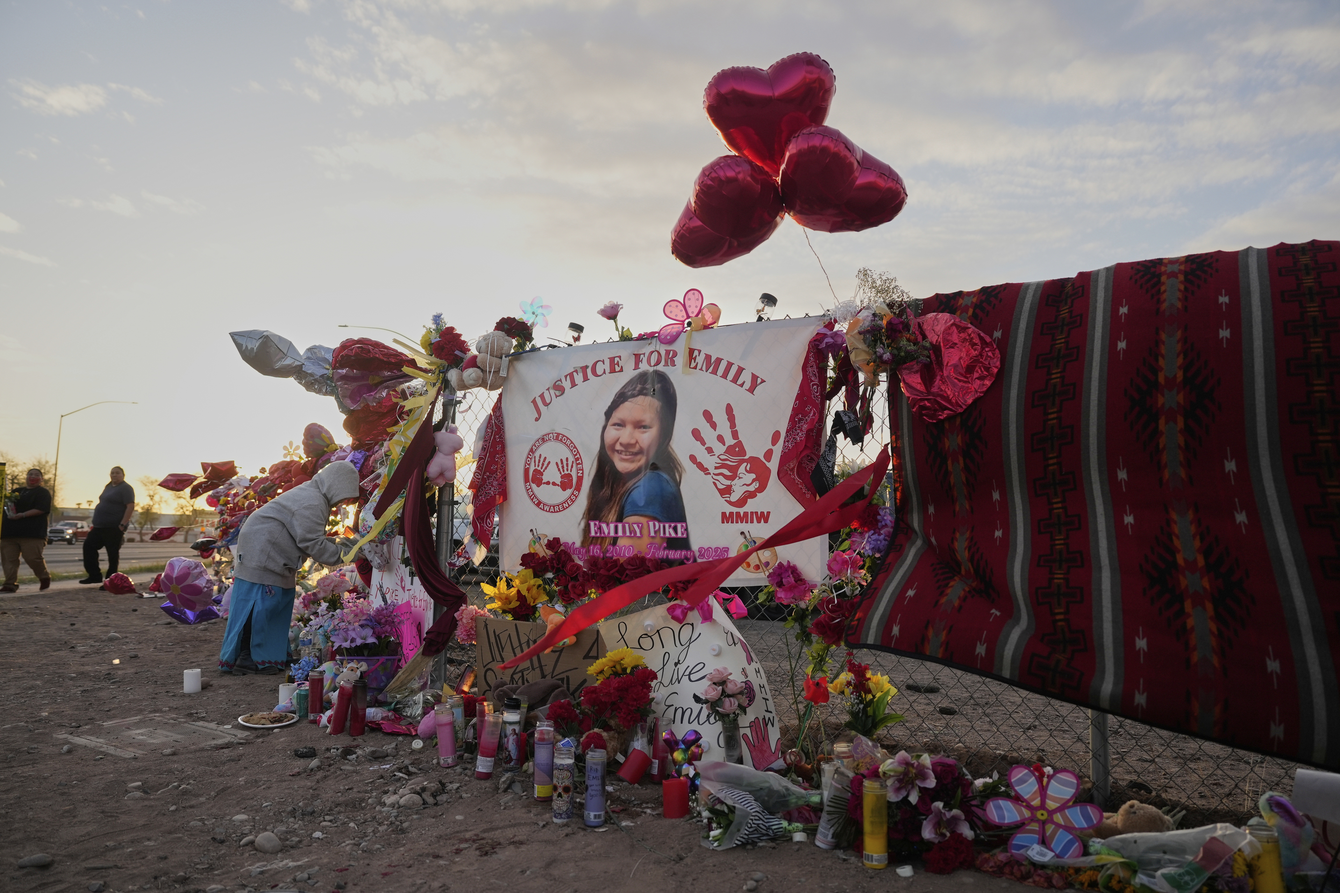 FILE - A tribute to slain Native American teen Emily Pike adorns a fence near a vigil in her honor in Mesa, Ariz., Thursday, March 6, 2025. (AP Photo/Samantha Chow, file)